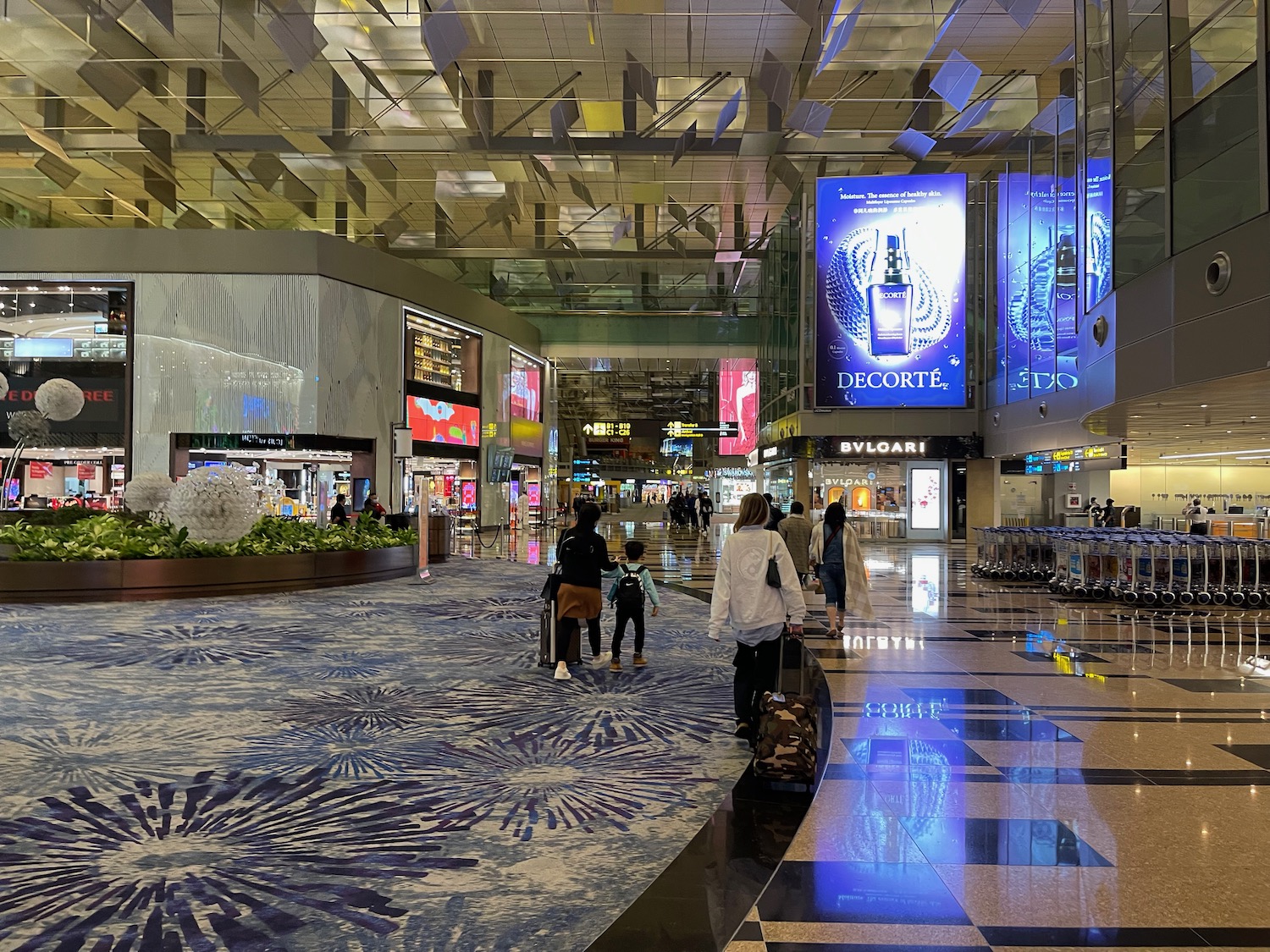 people walking in a large airport