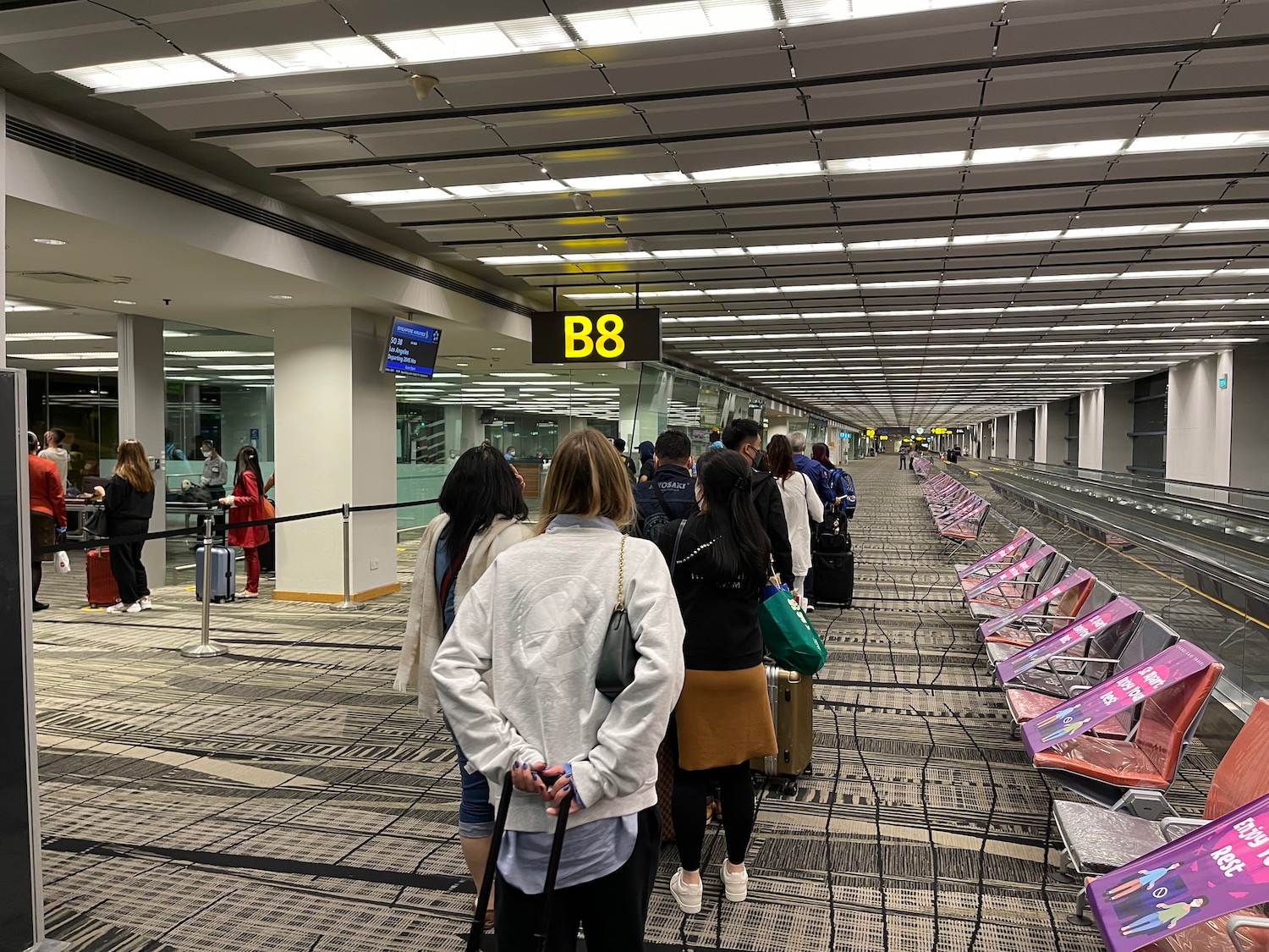 a group of people in an airport