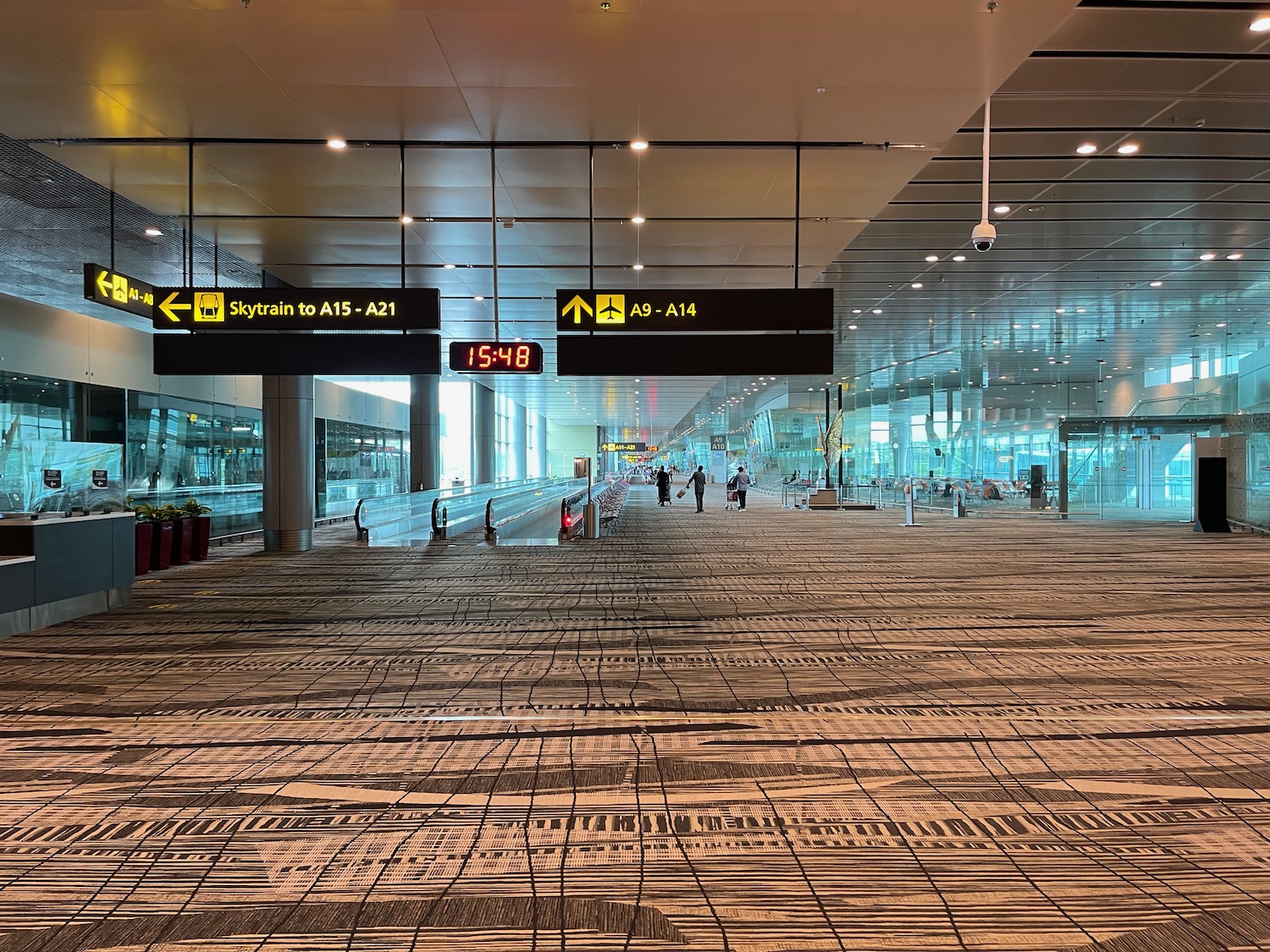 a group of people walking in an airport