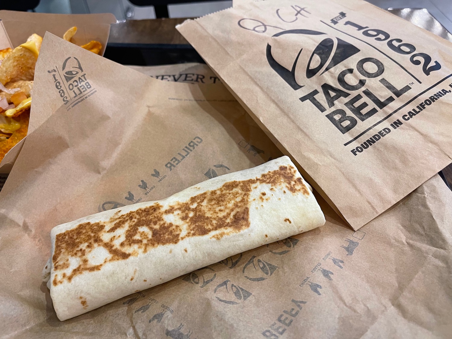 a burrito and some paper bags