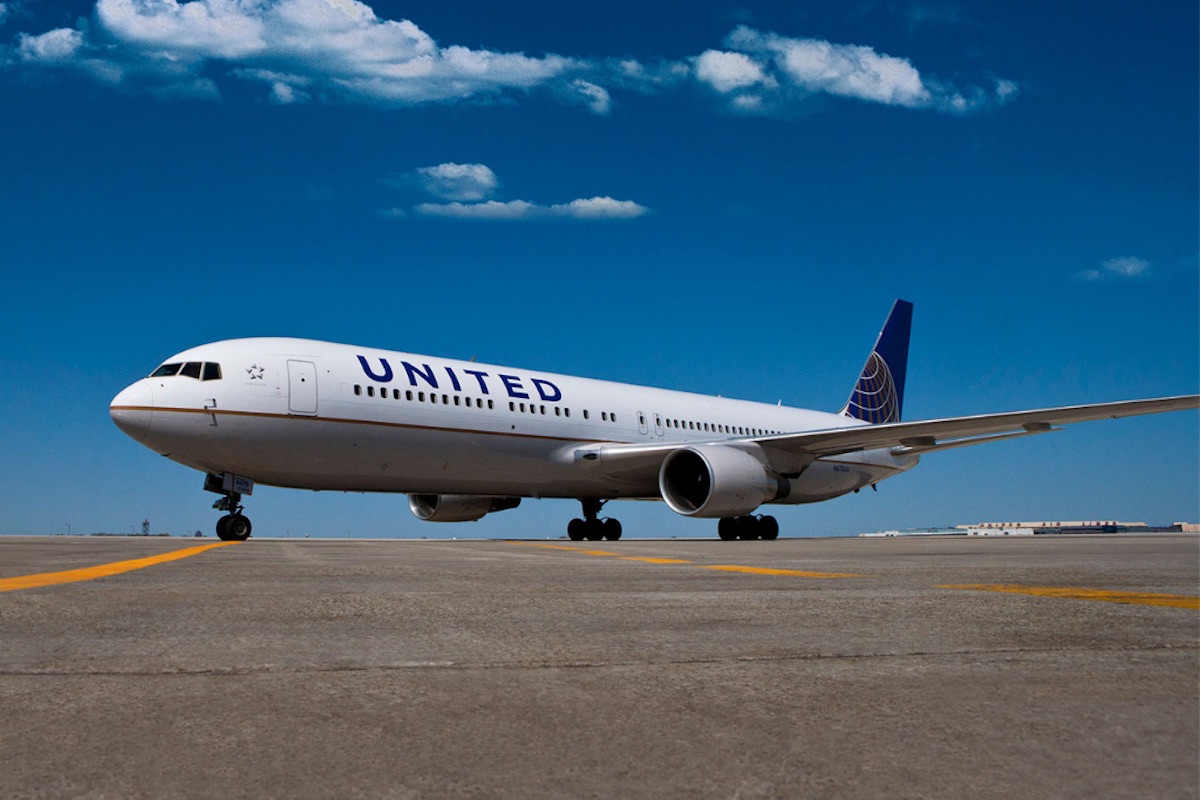 a white airplane on a runway