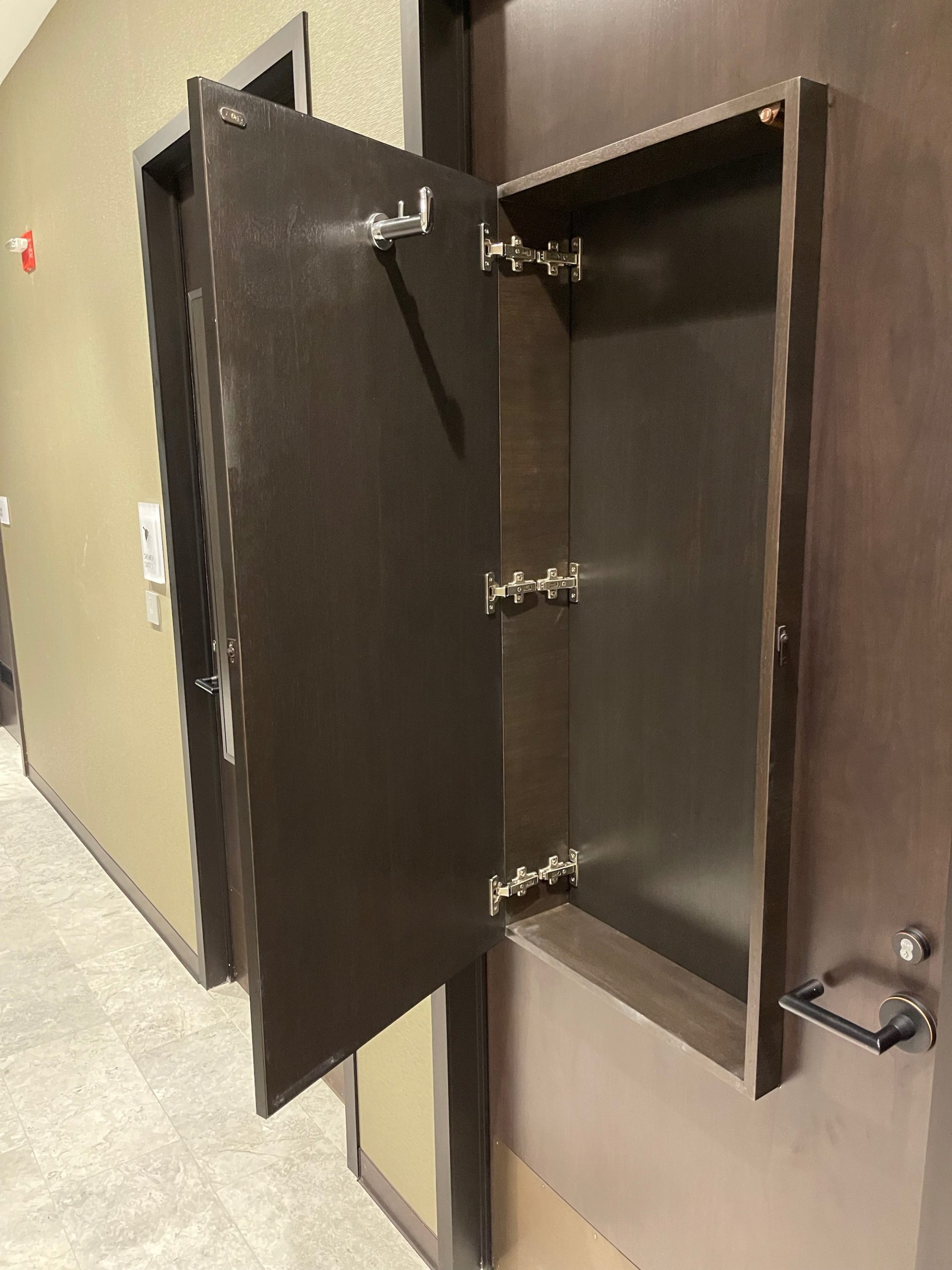 a brown cabinet with a door open