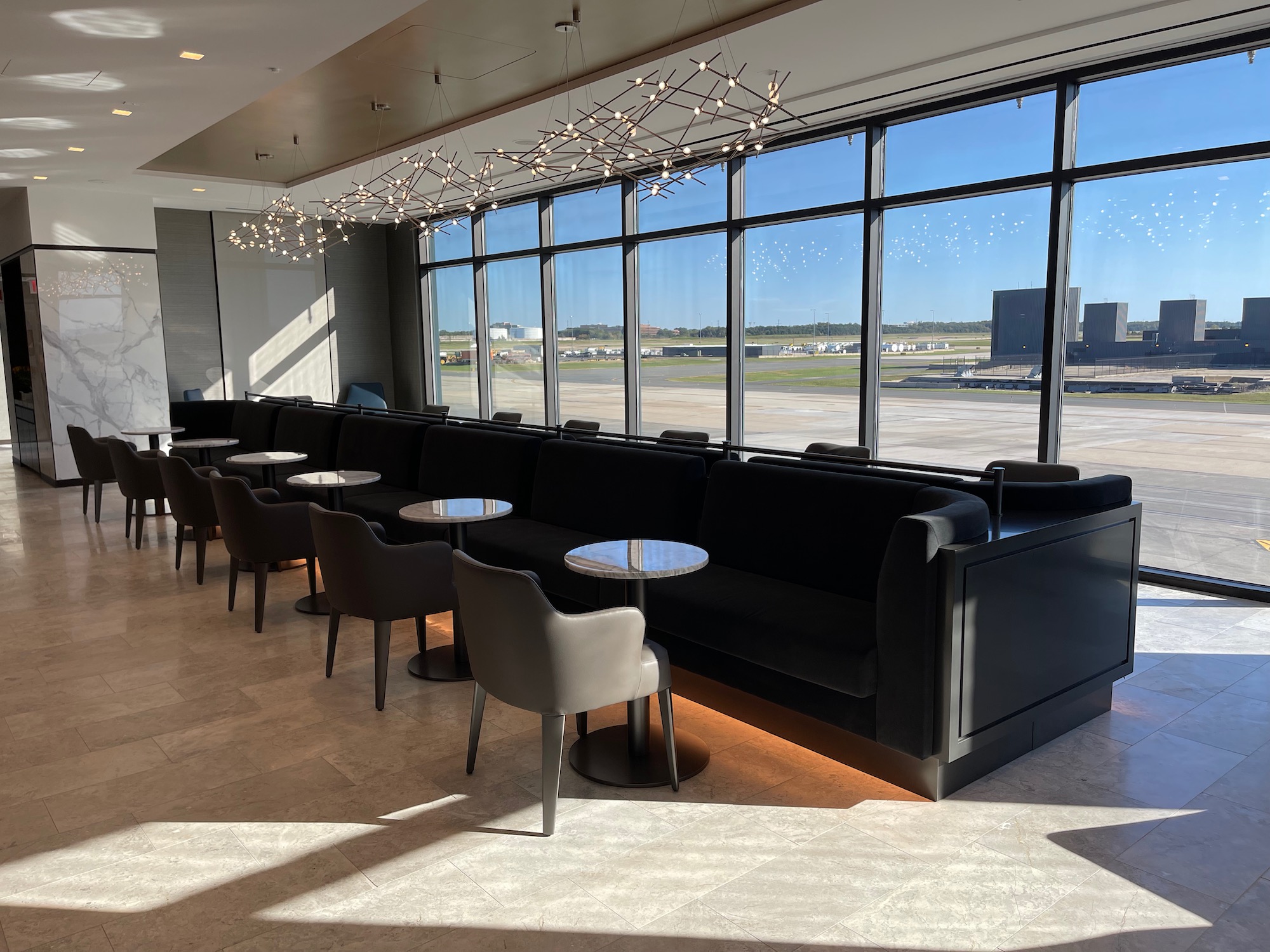 a room with rows of chairs and tables