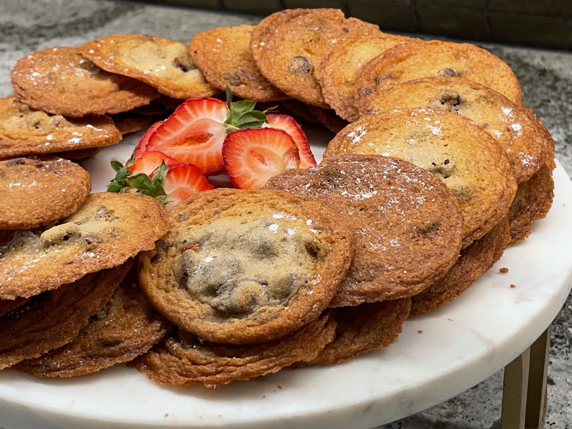 a plate of cookies and strawberries