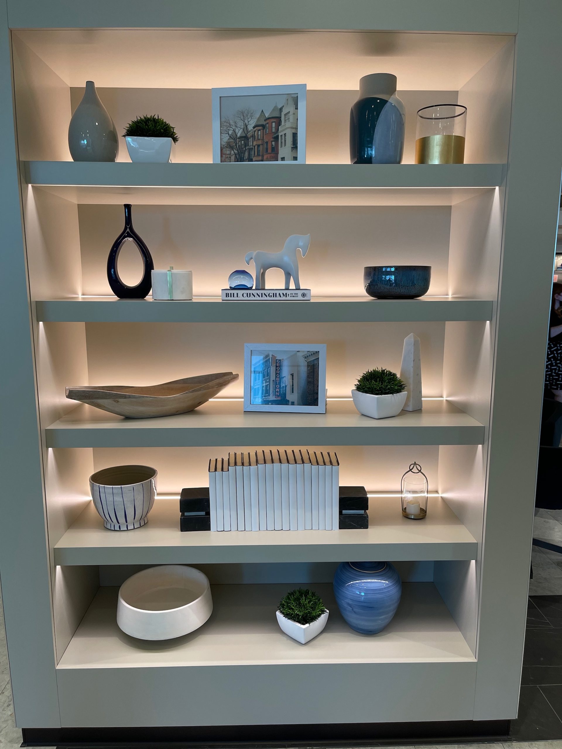 a shelf with shelves and objects on it