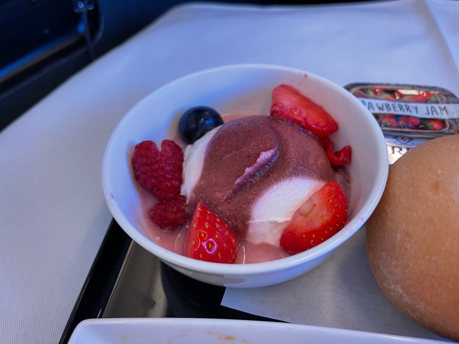 a bowl of ice cream with fruit