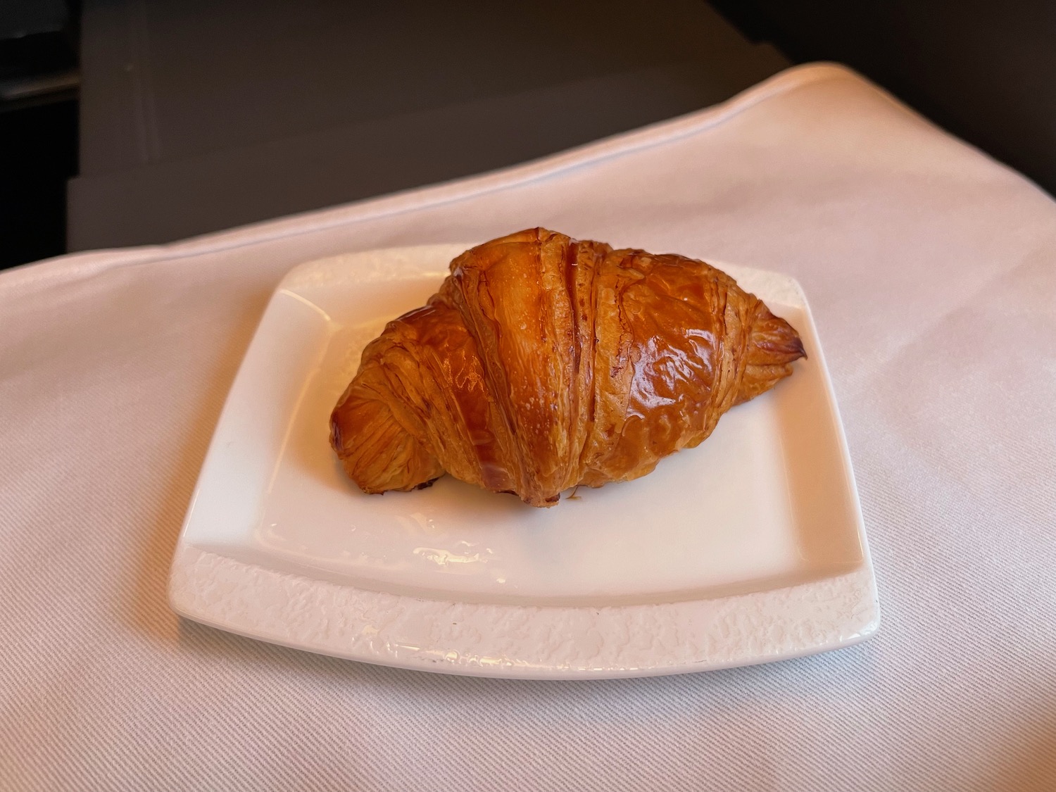 a croissant on a plate