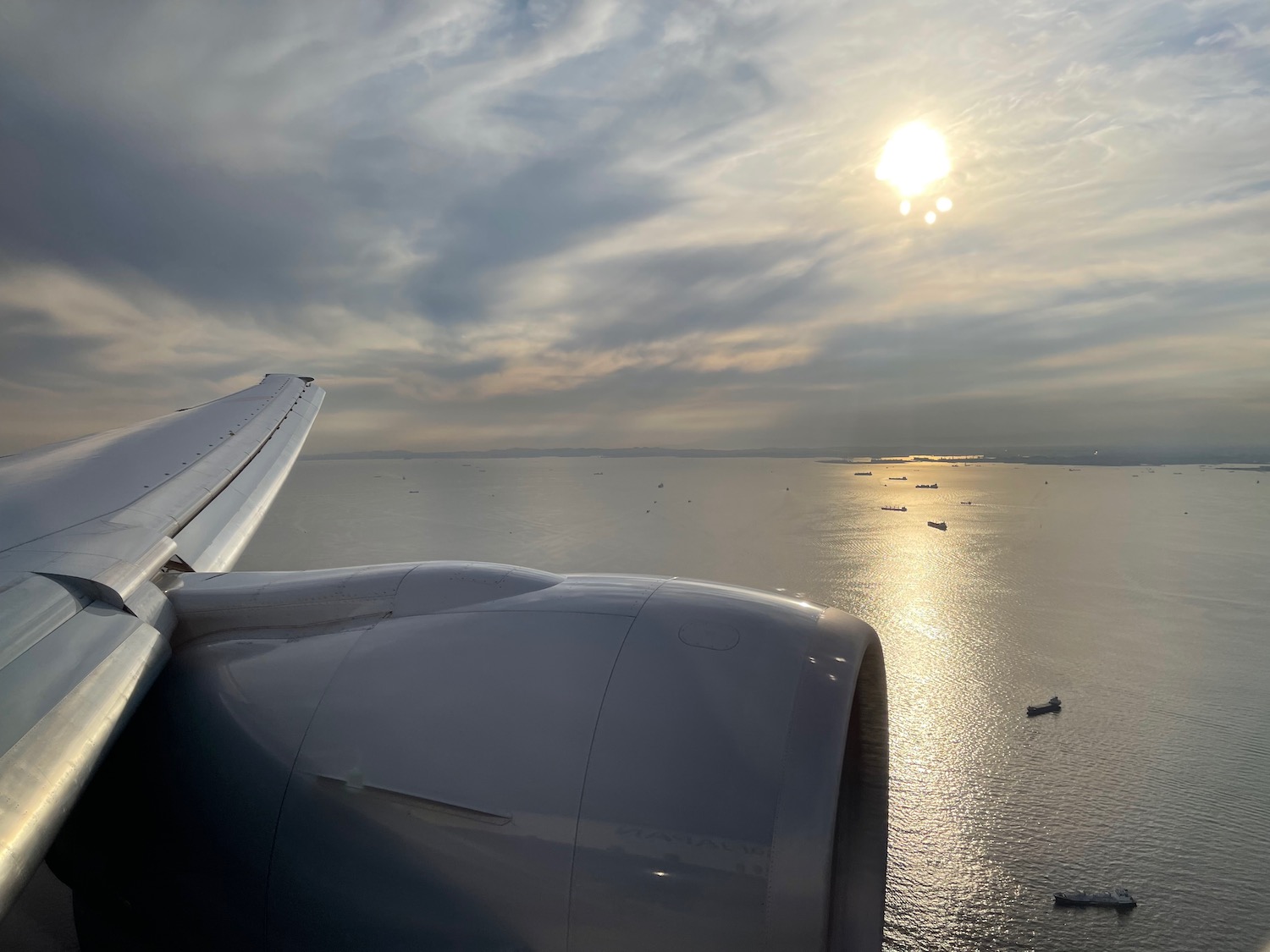 an airplane wing and engine on water