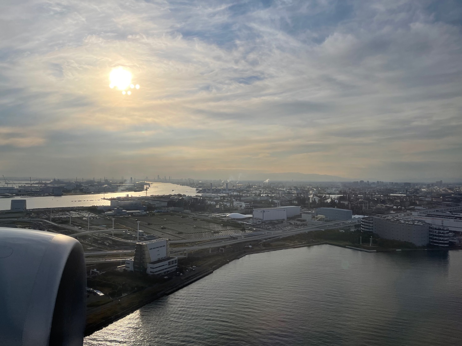 a view of a city and water from a plane