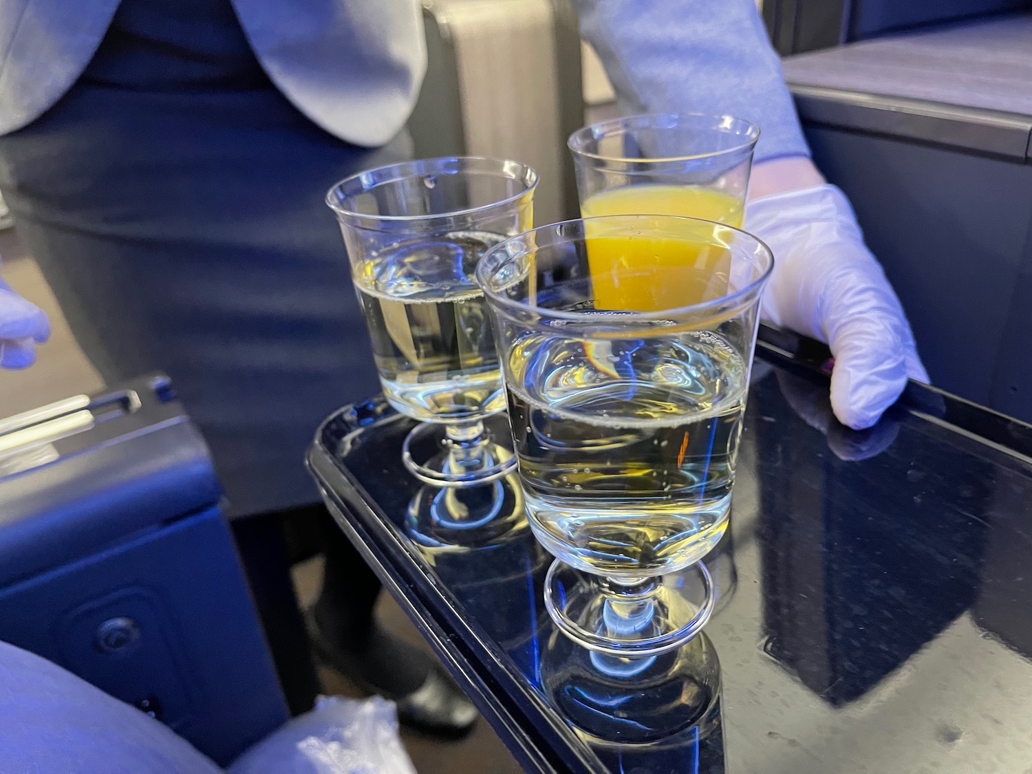 a tray of glasses with liquid on it