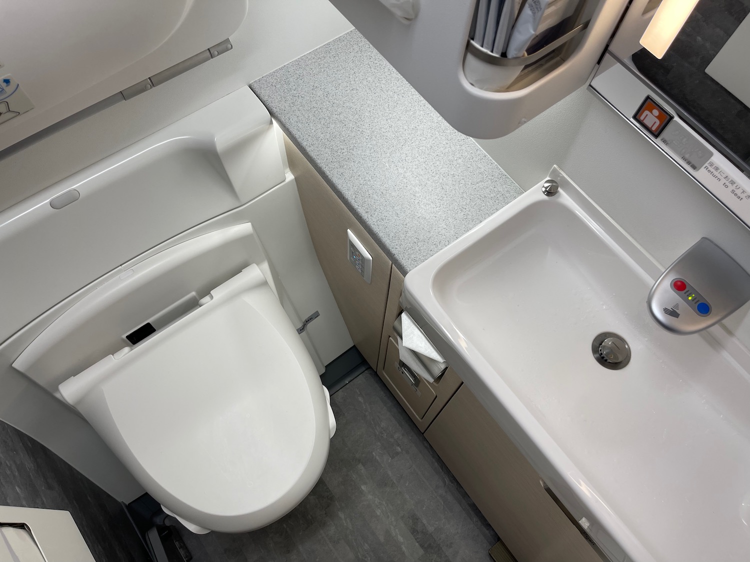 a bathroom with a sink and toilet