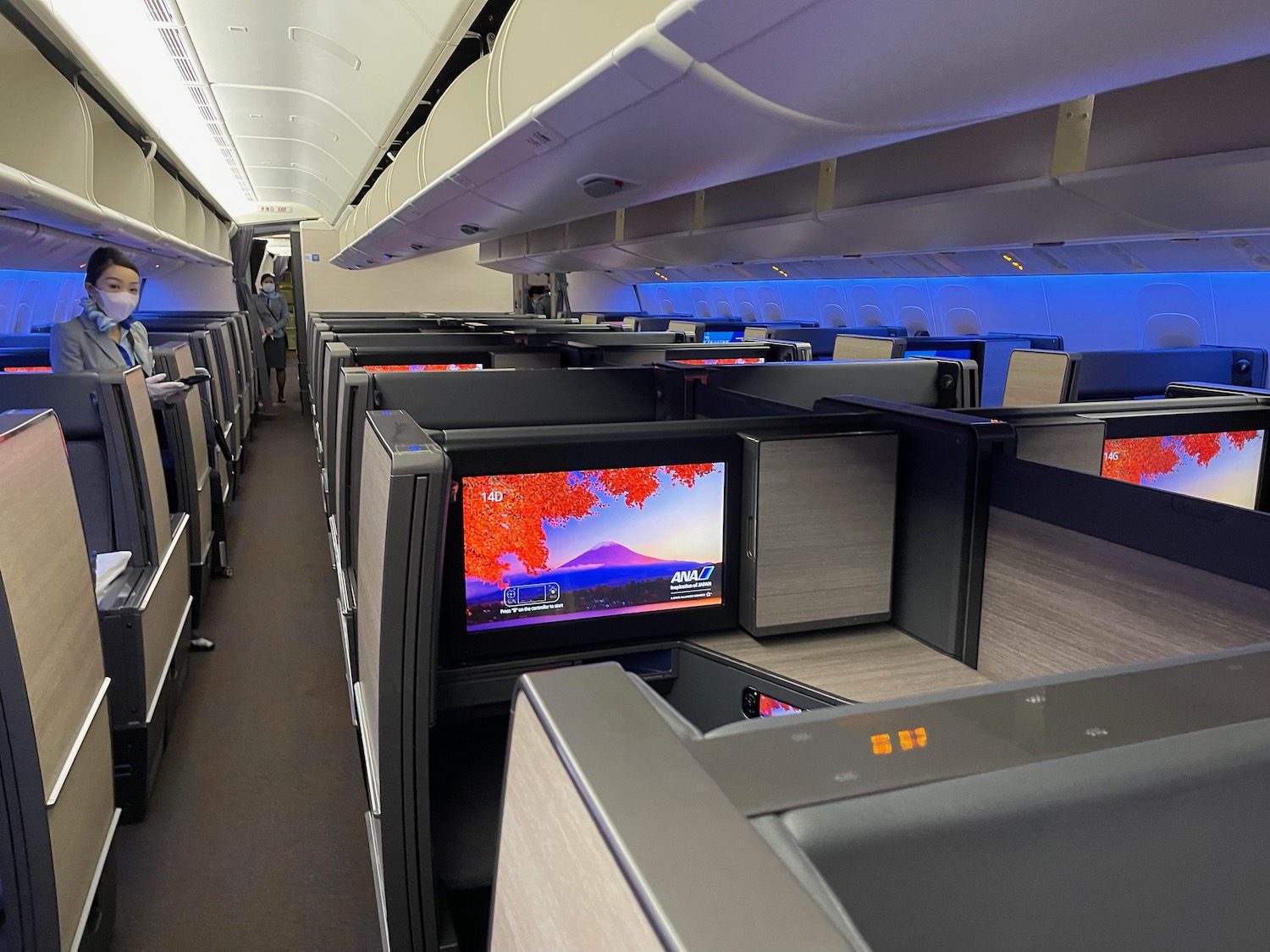 a row of monitors on an airplane