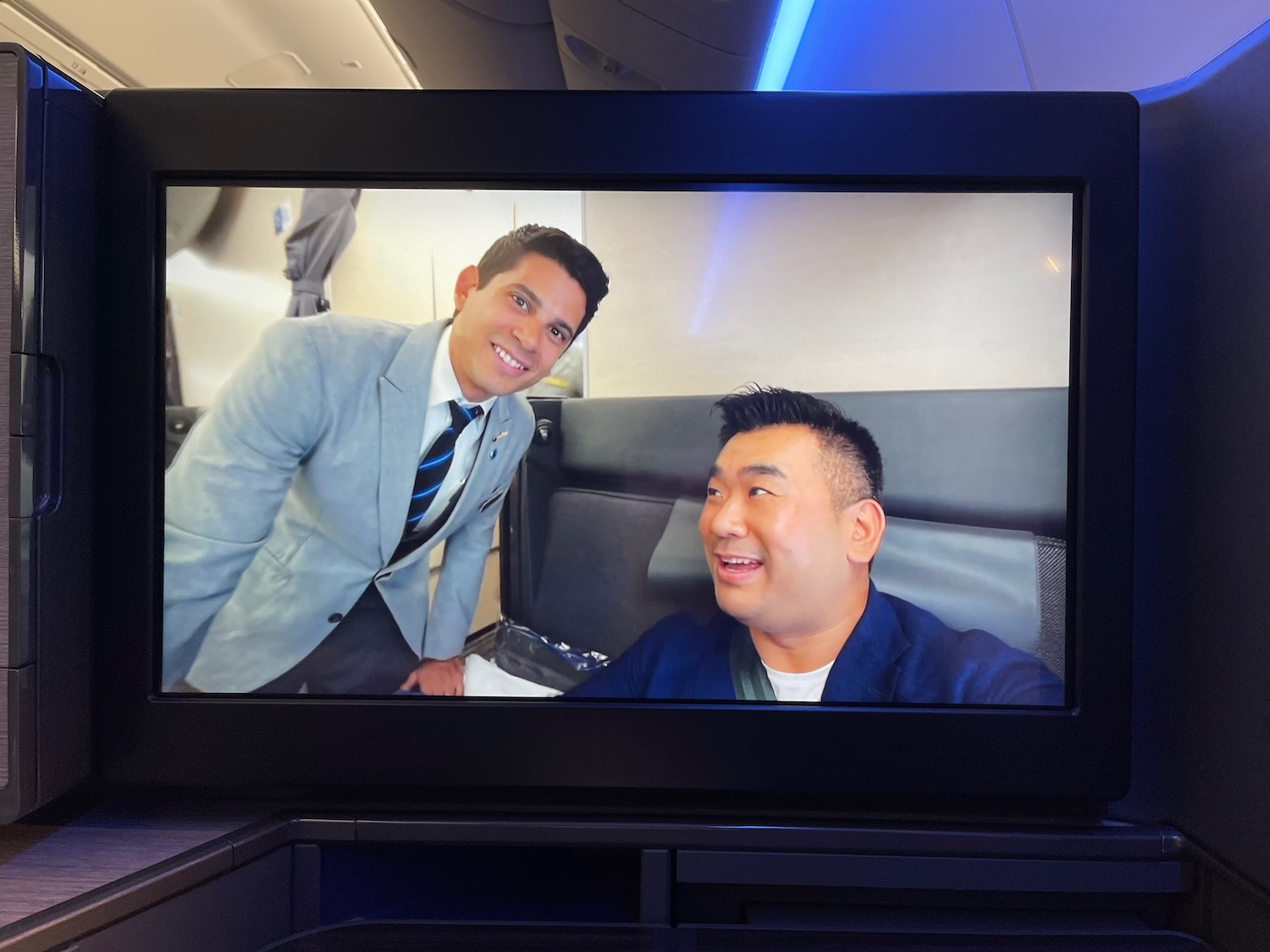 a tv screen with two men on it