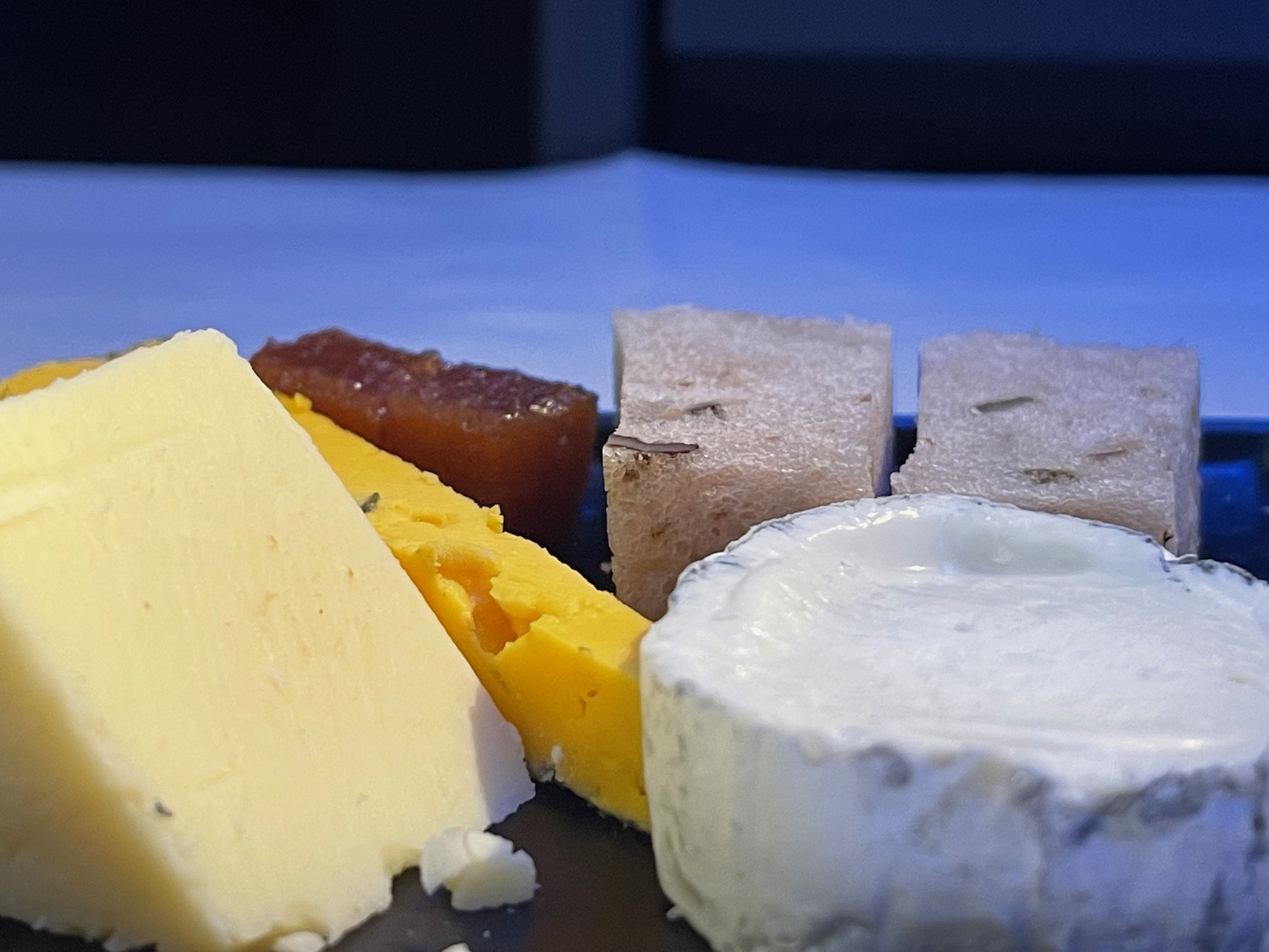 a plate of cheeses