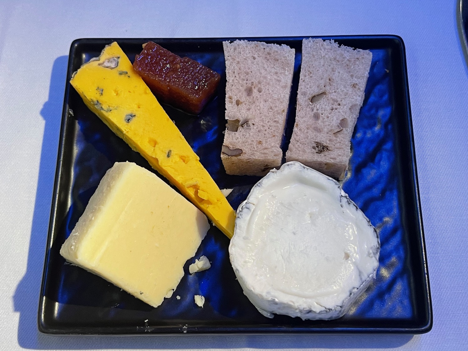 a plate of cheeses