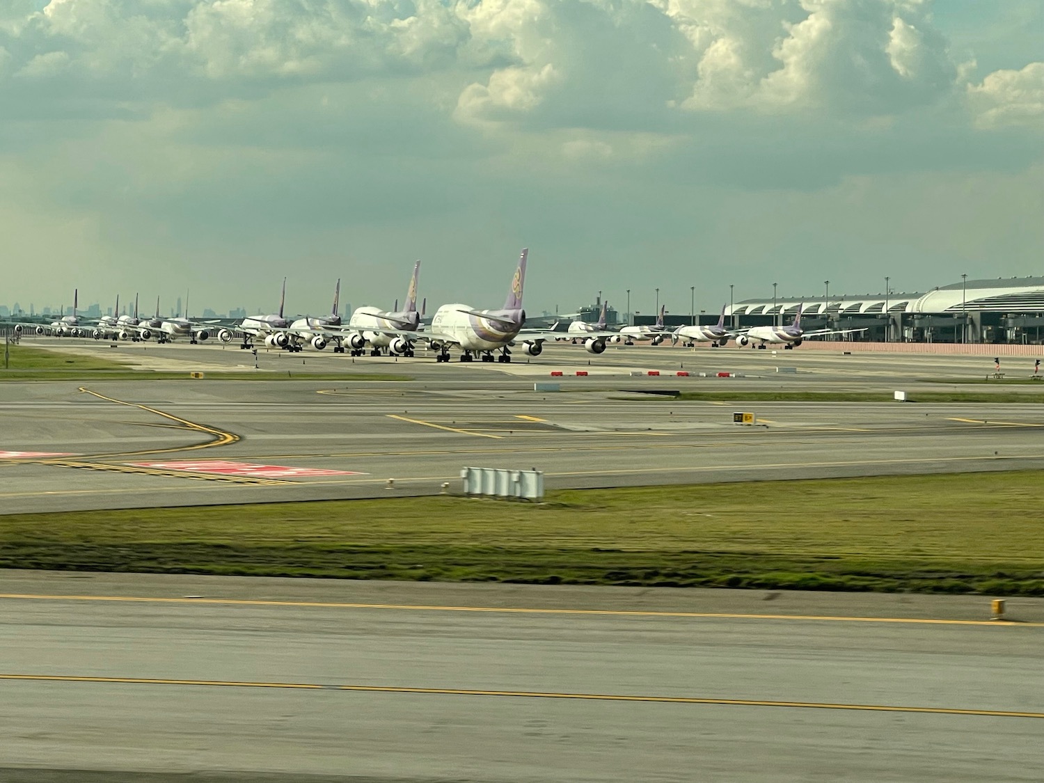 a group of airplanes on a runway