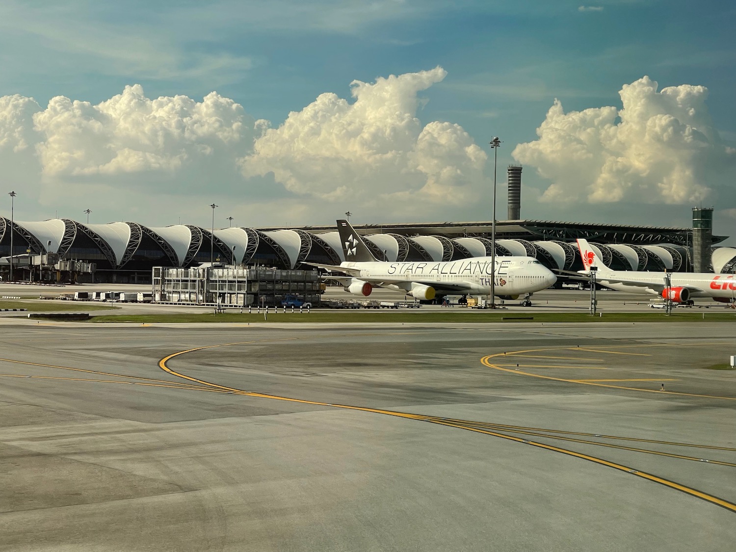 a group of airplanes on a runway