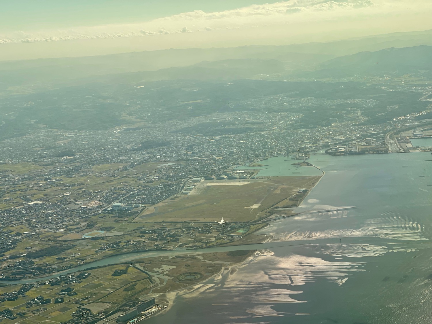 an aerial view of a city and water