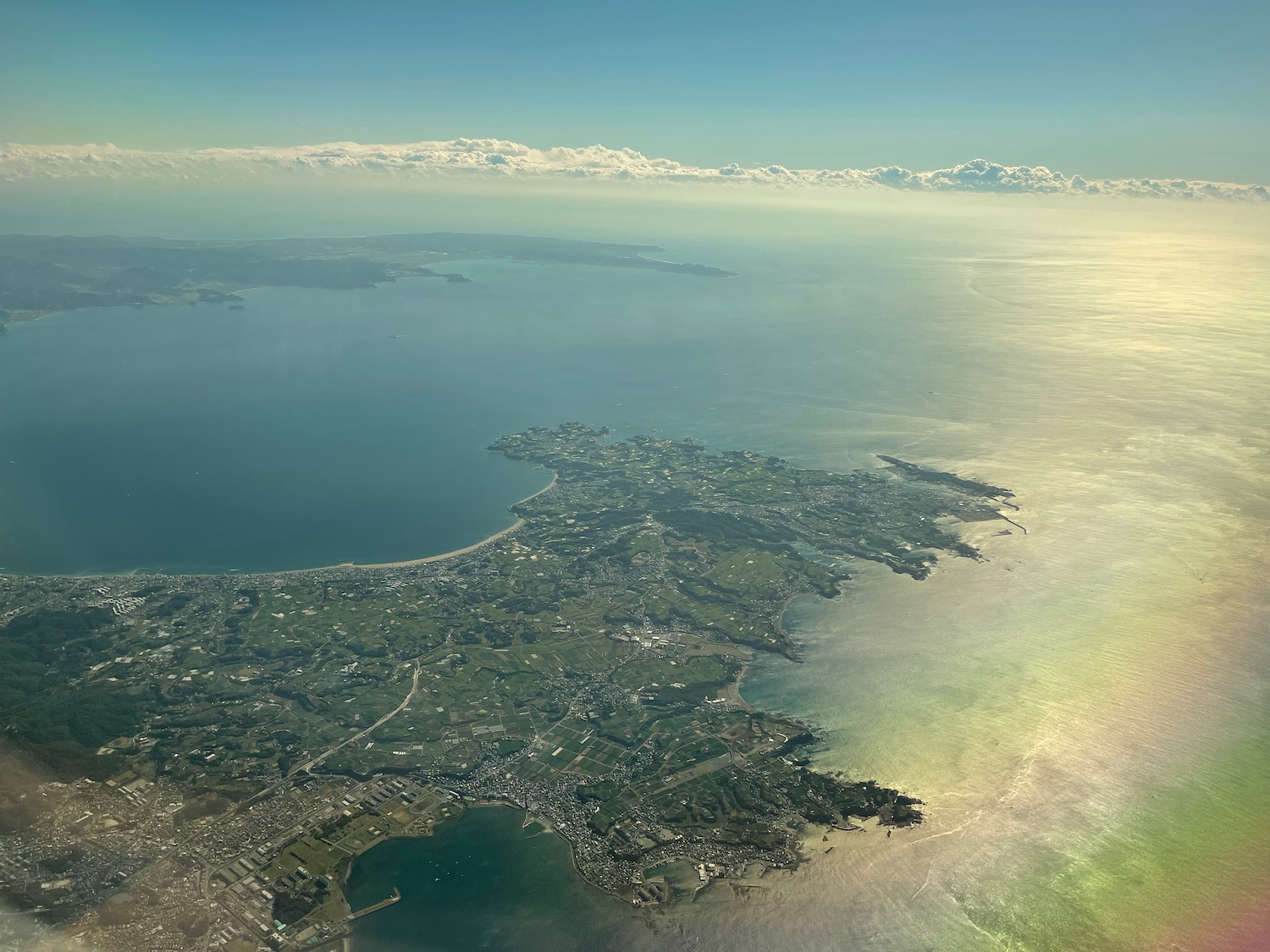 an aerial view of land and water