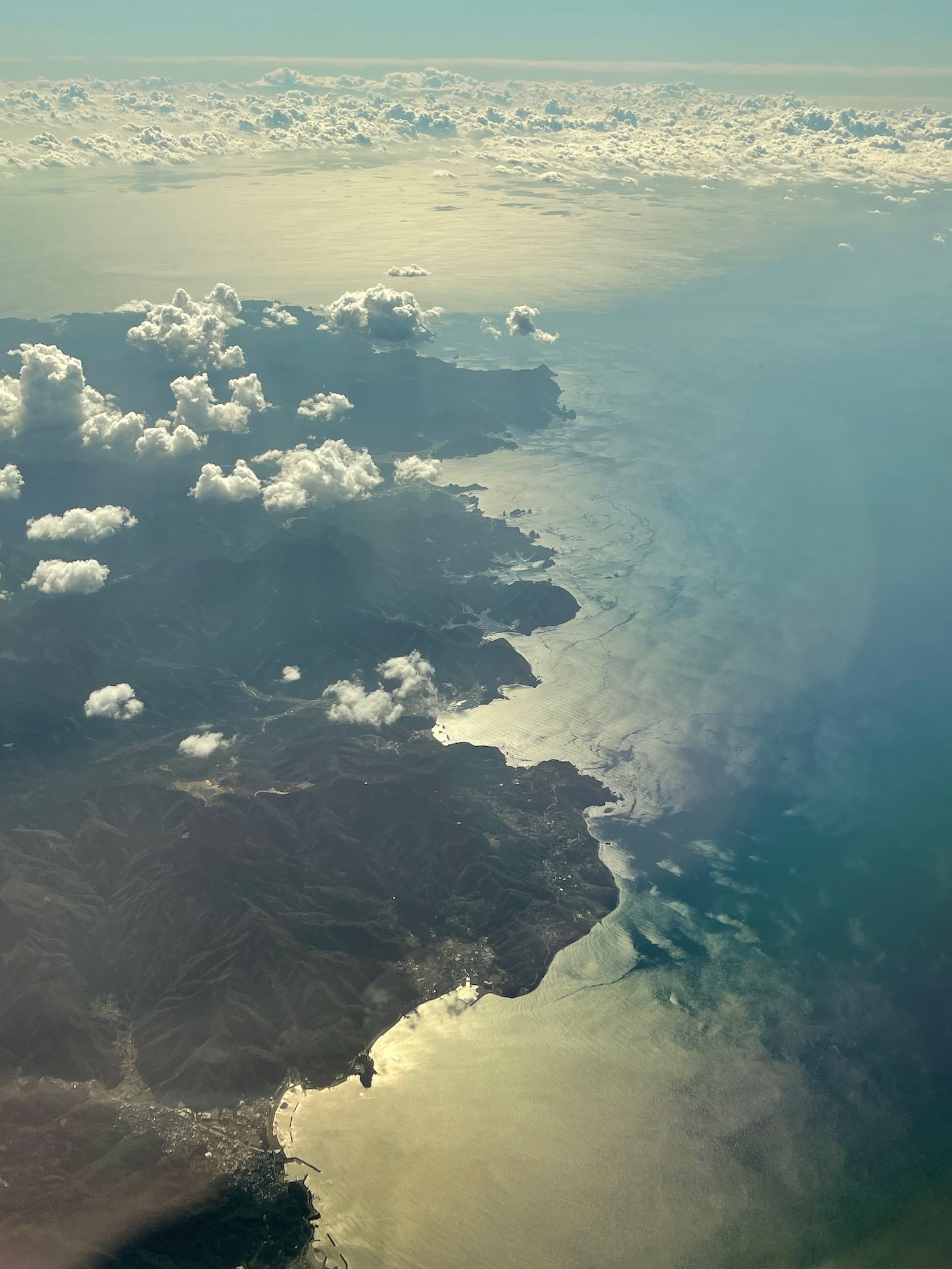 aerial view of land and water from an airplane