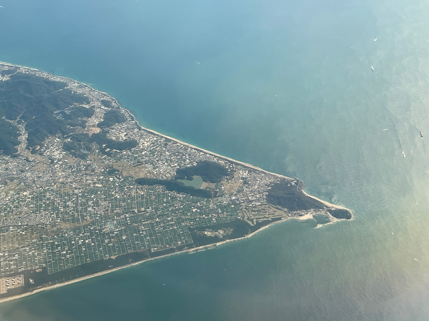 an aerial view of a city and water