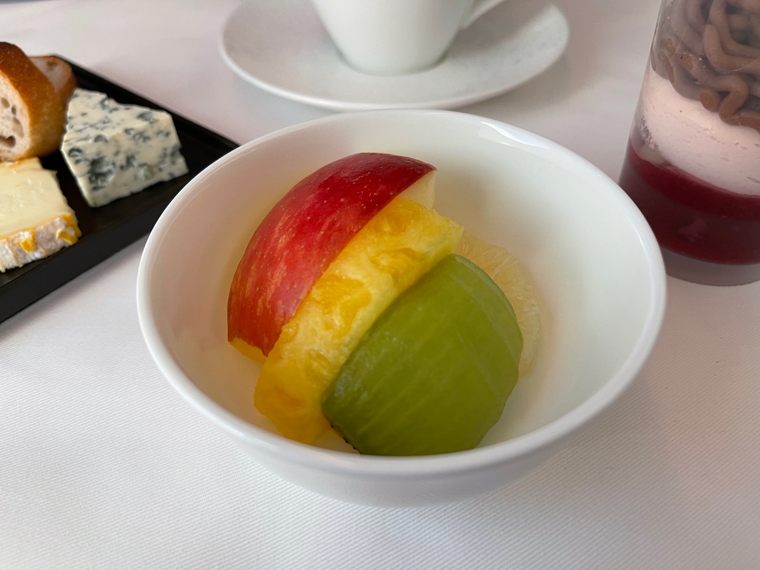 a bowl of fruit on a table