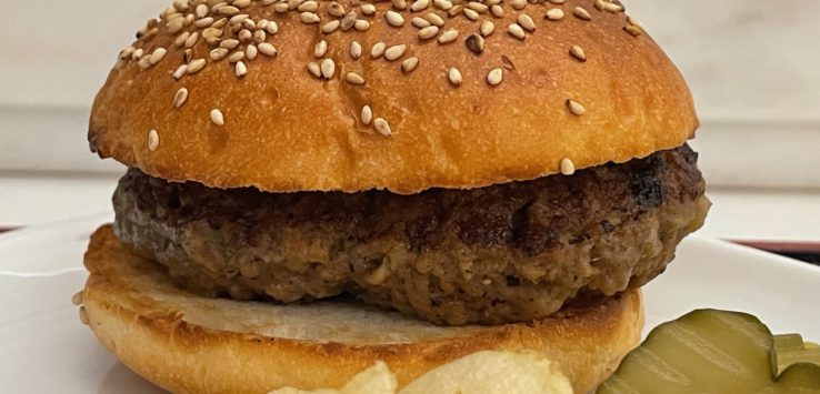 a hamburger and chips on a plate