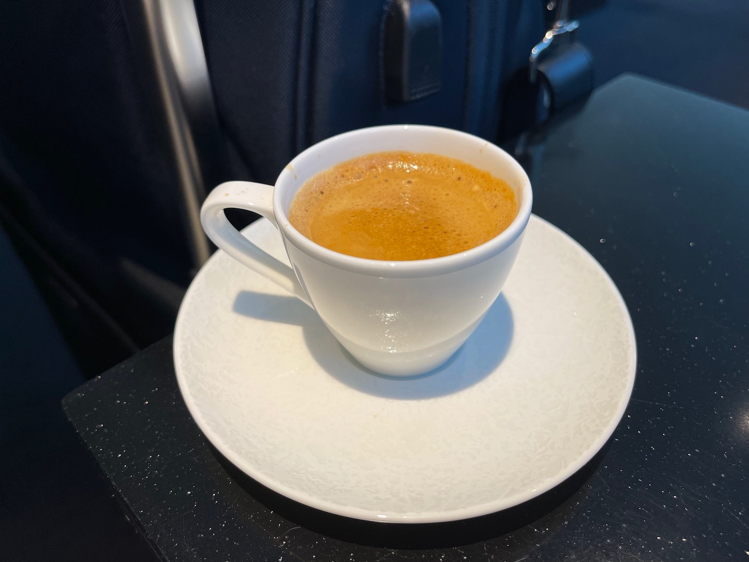 a cup of coffee on a saucer