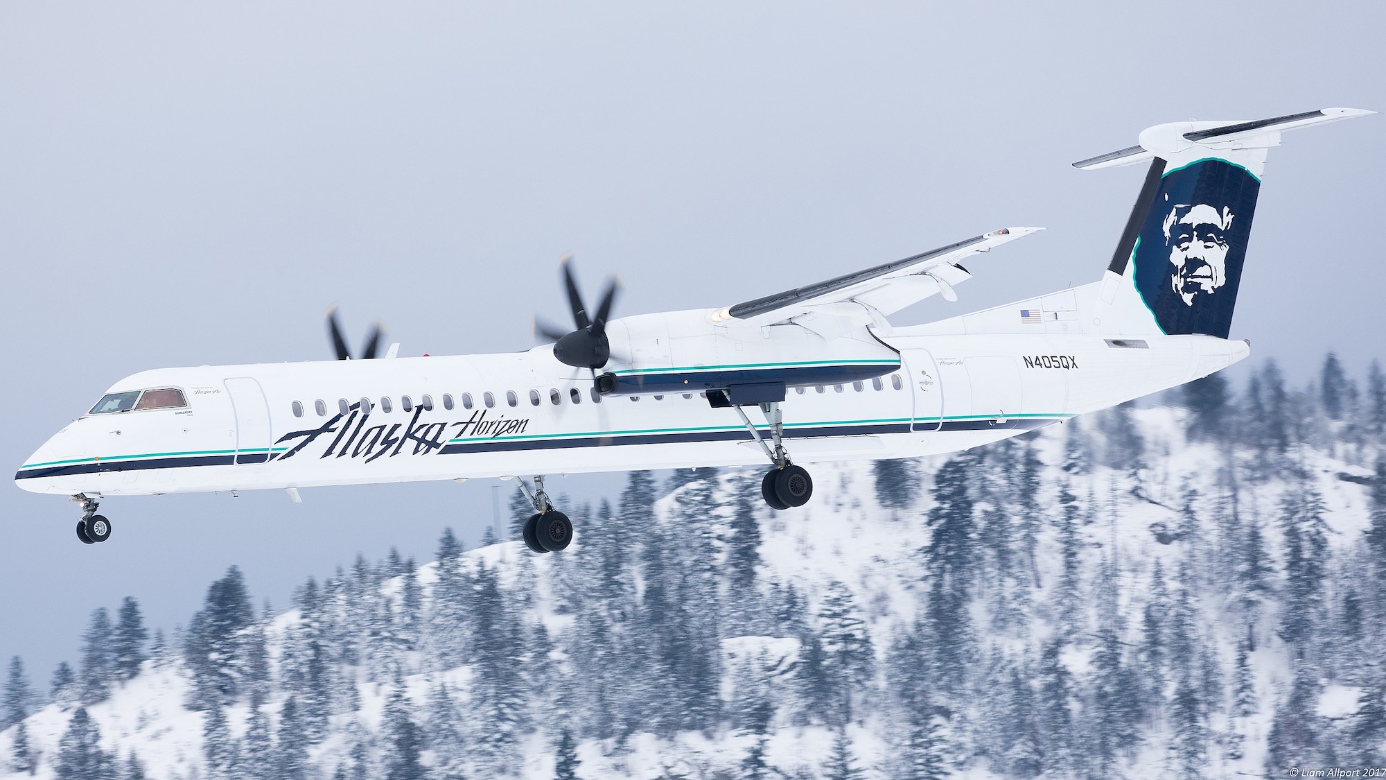 a plane flying in the snow