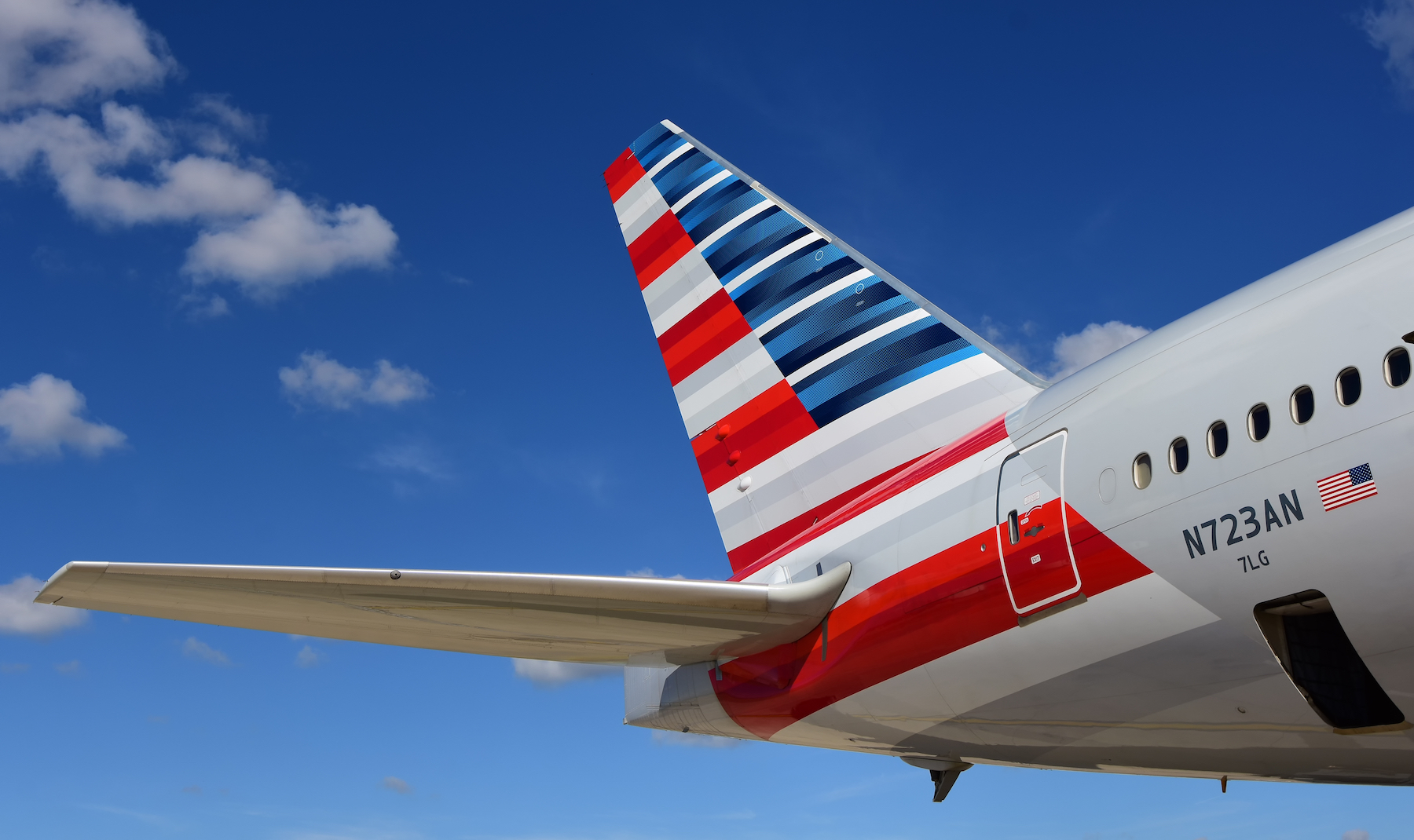 the tail of an airplane with stripes on it