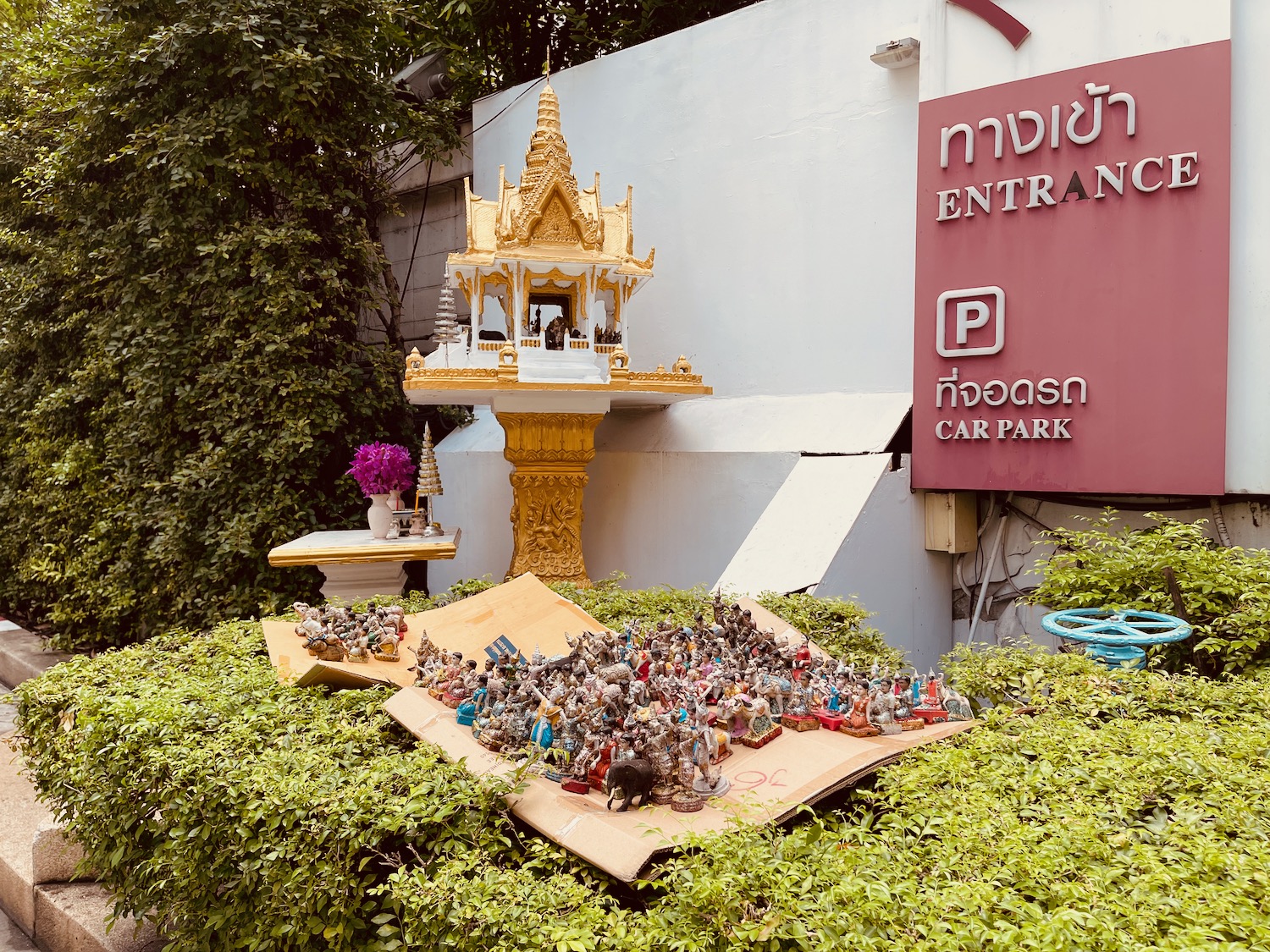 a group of figurines on a box in front of a sign