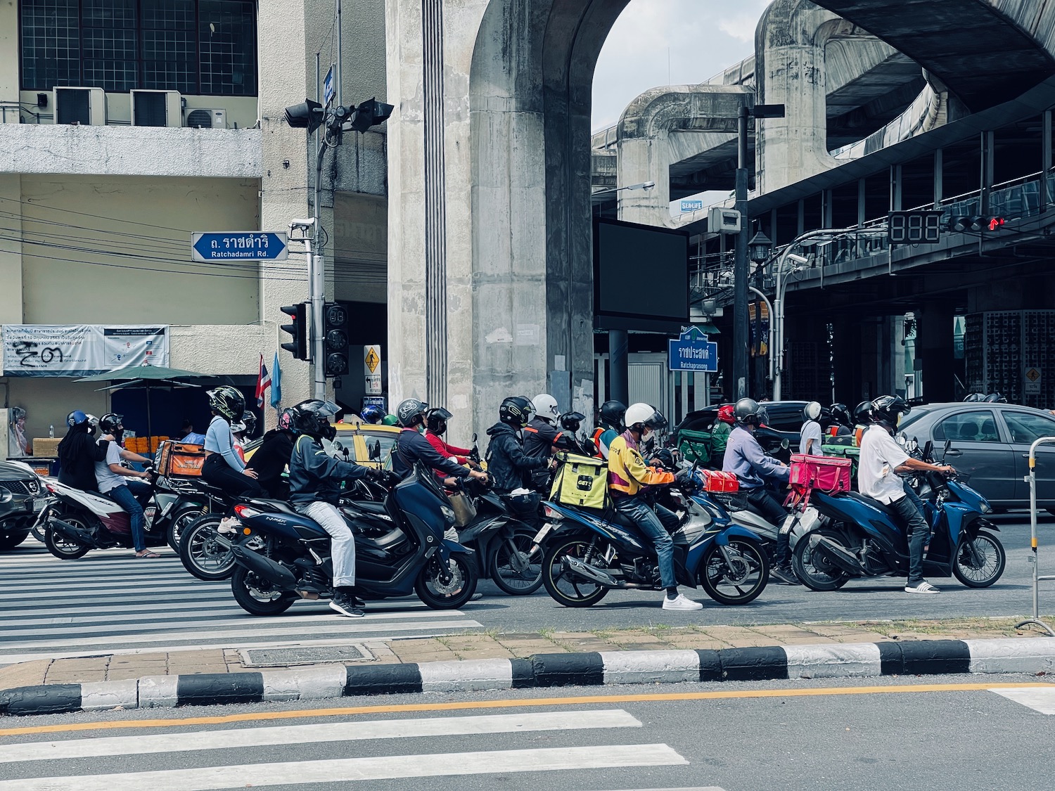 a group of people on motorcycles in a street