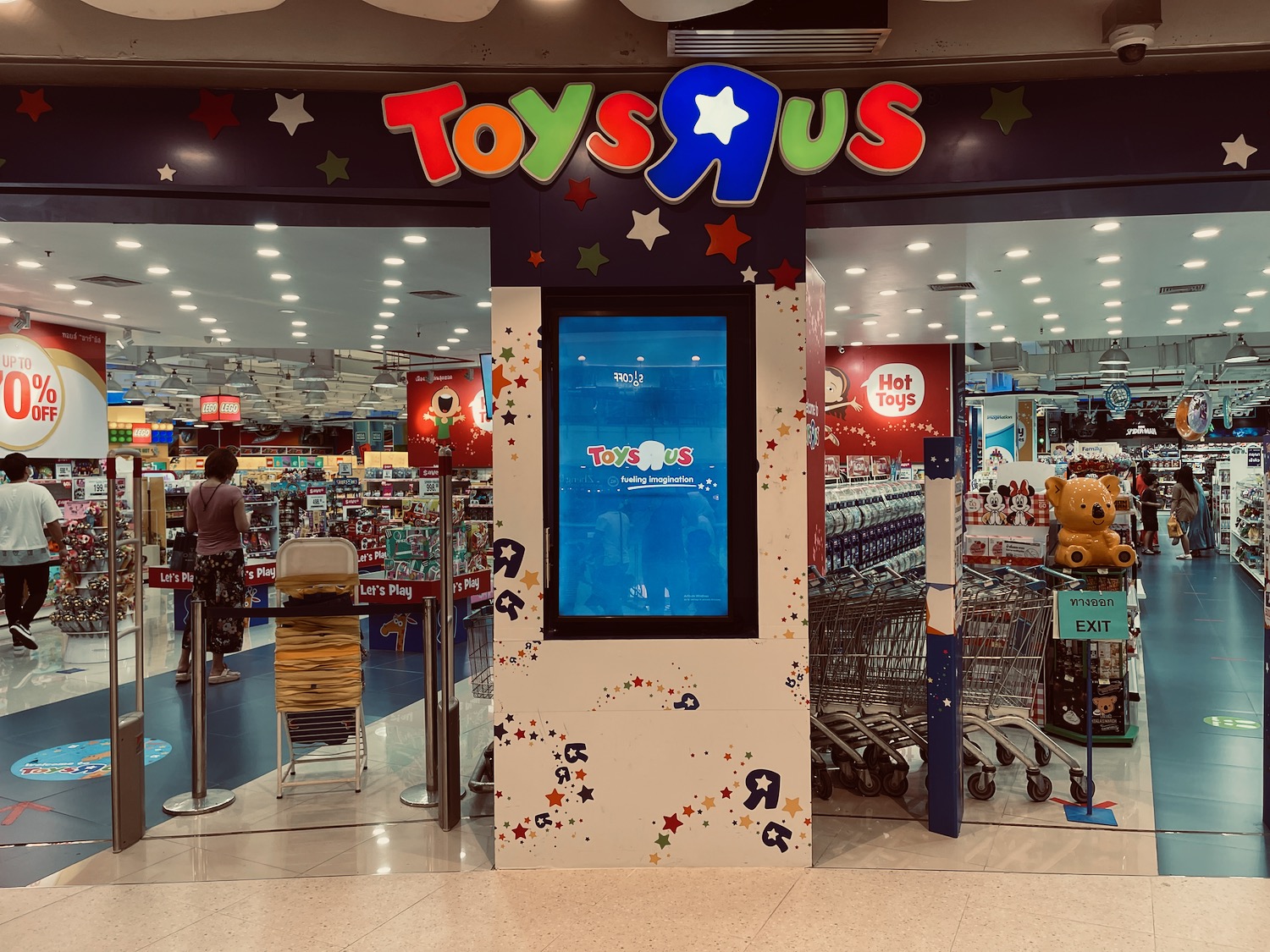 a store front with a screen and a sign