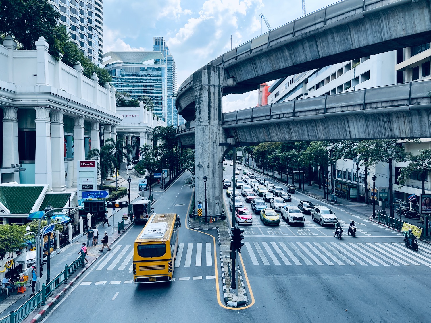 a city street with cars and a bus