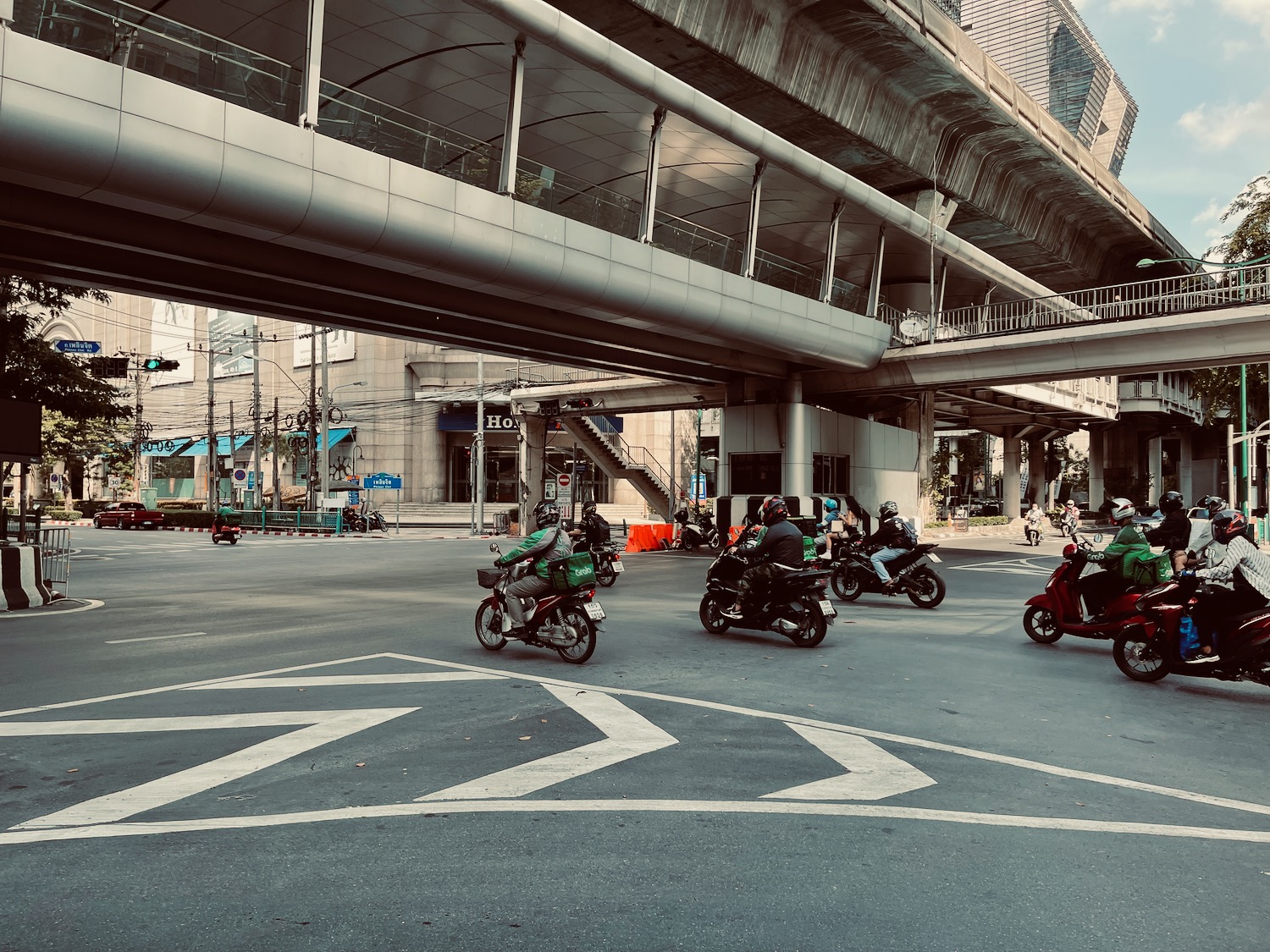 a group of people on motorcycles in a city