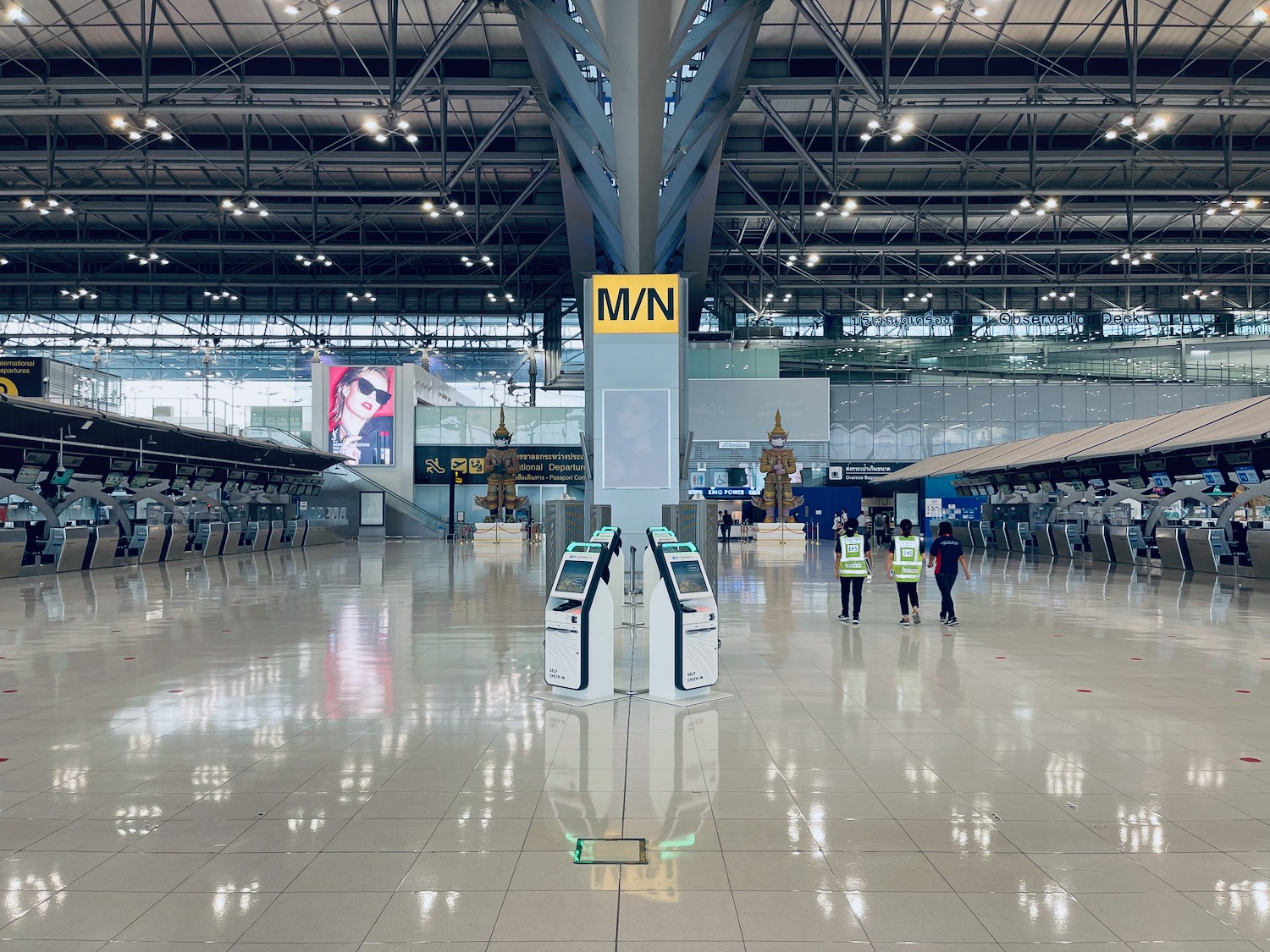 people standing in a large hall