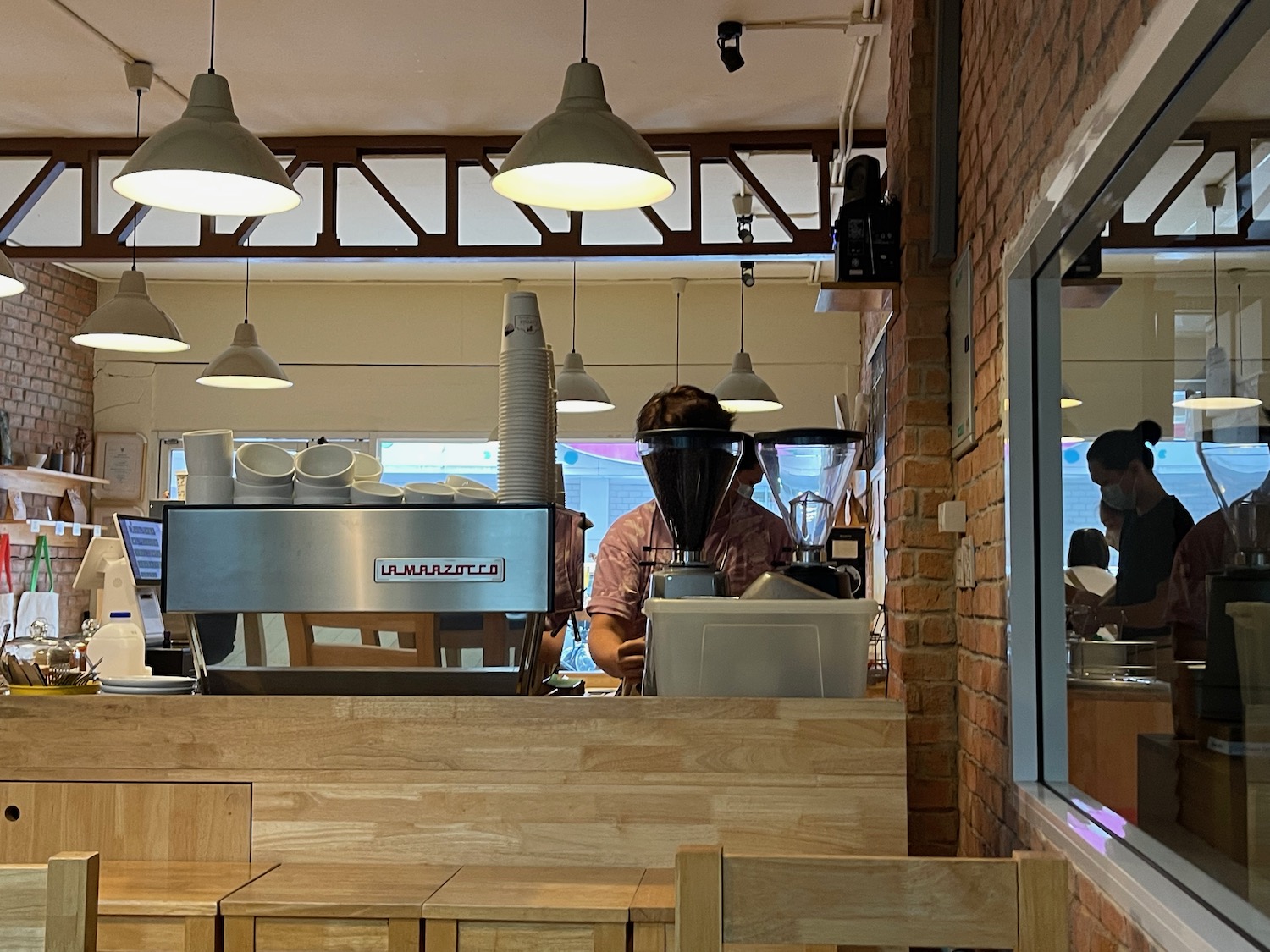 a man behind a counter in a restaurant