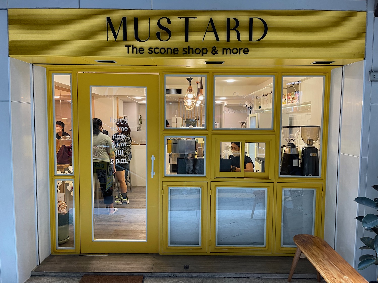 a yellow store front with glass doors