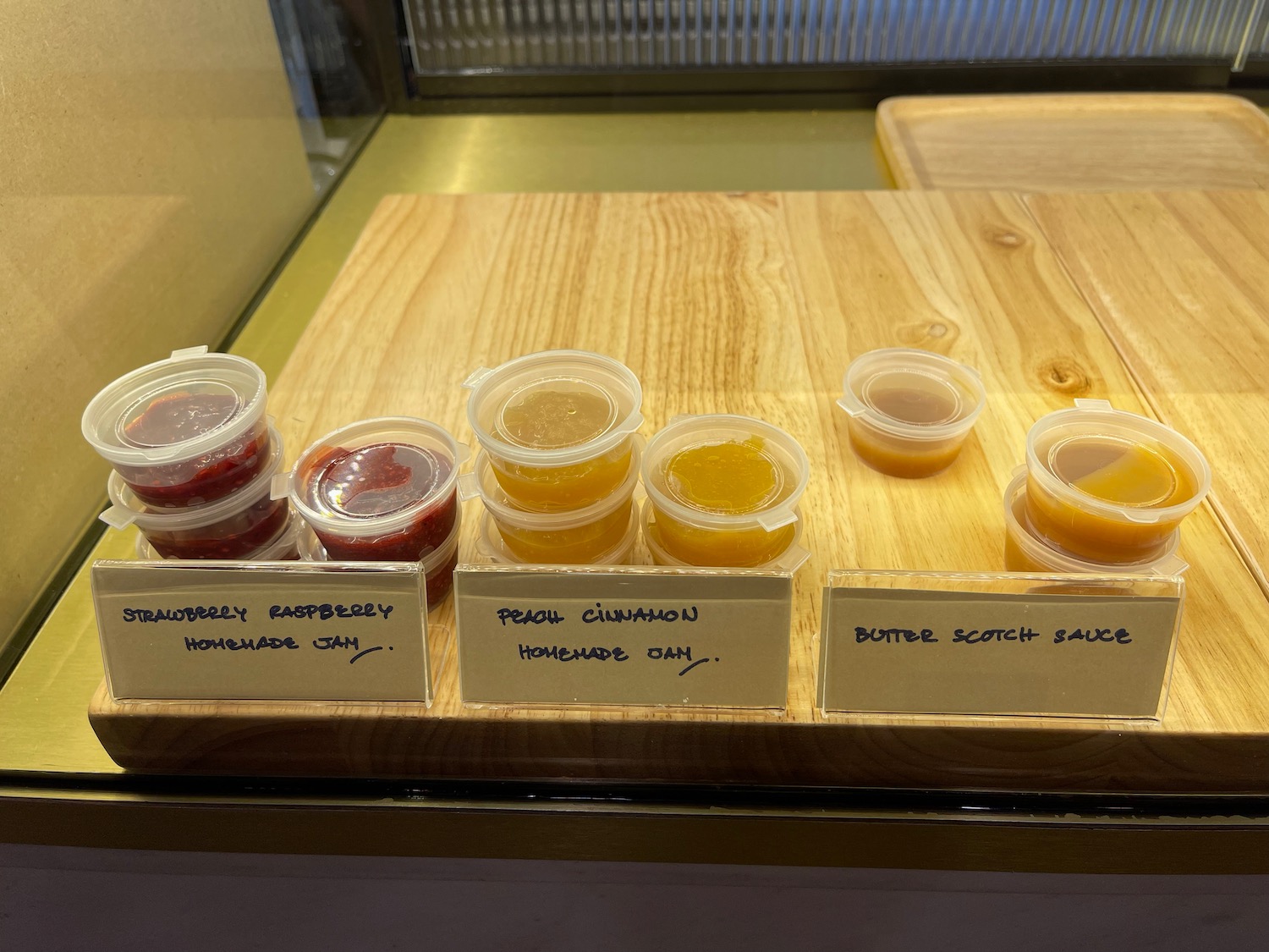a group of small plastic containers with different flavors