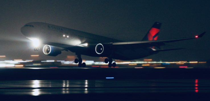 a plane taking off at night