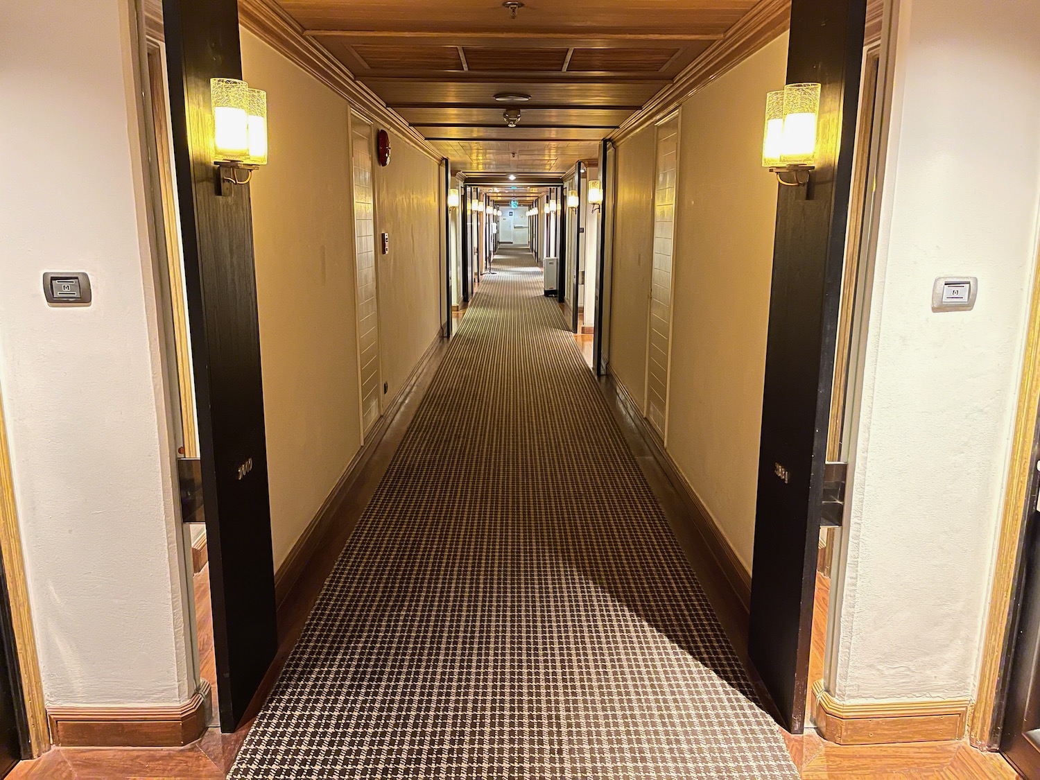 a hallway with a carpeted floor