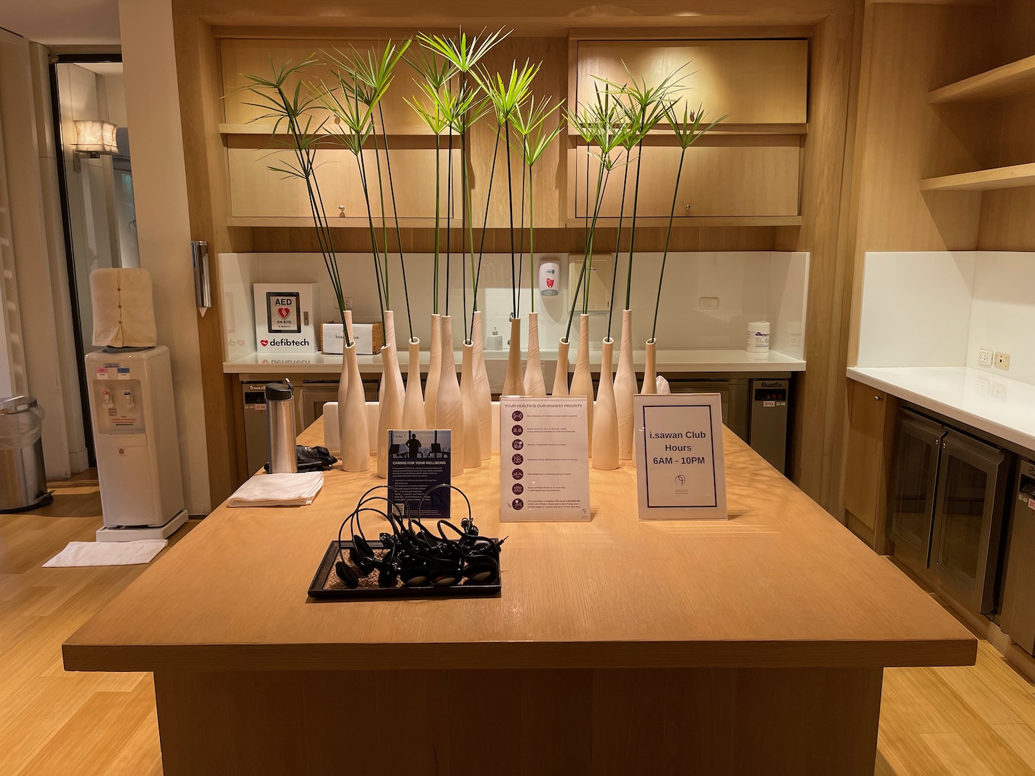 a table with vases and plants on it