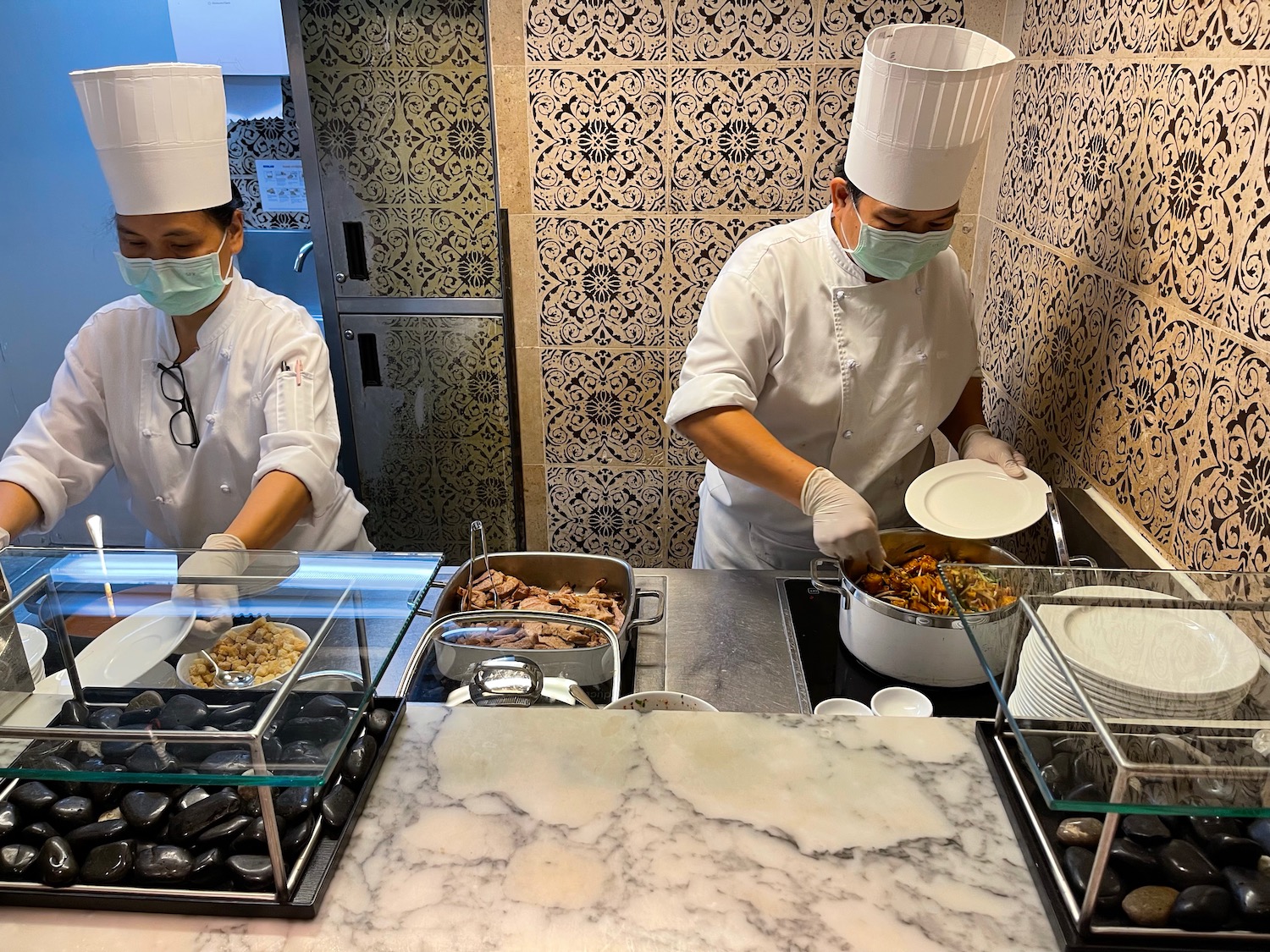 two chefs cooking in a kitchen