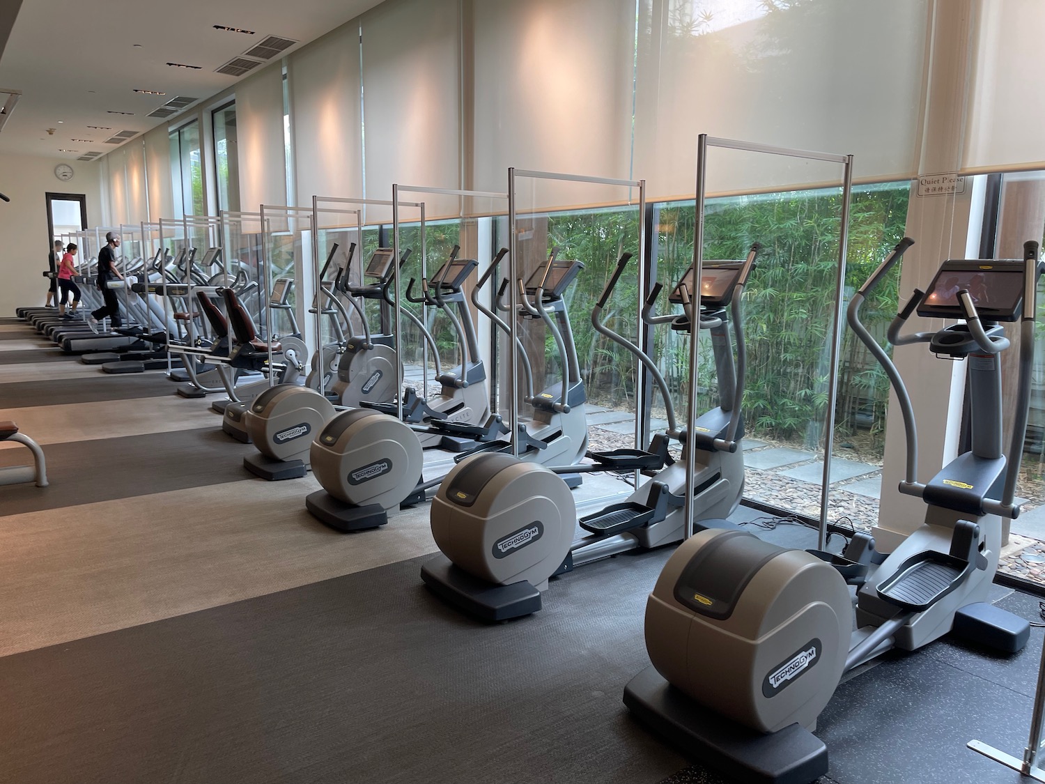 a group of exercise machines in a room