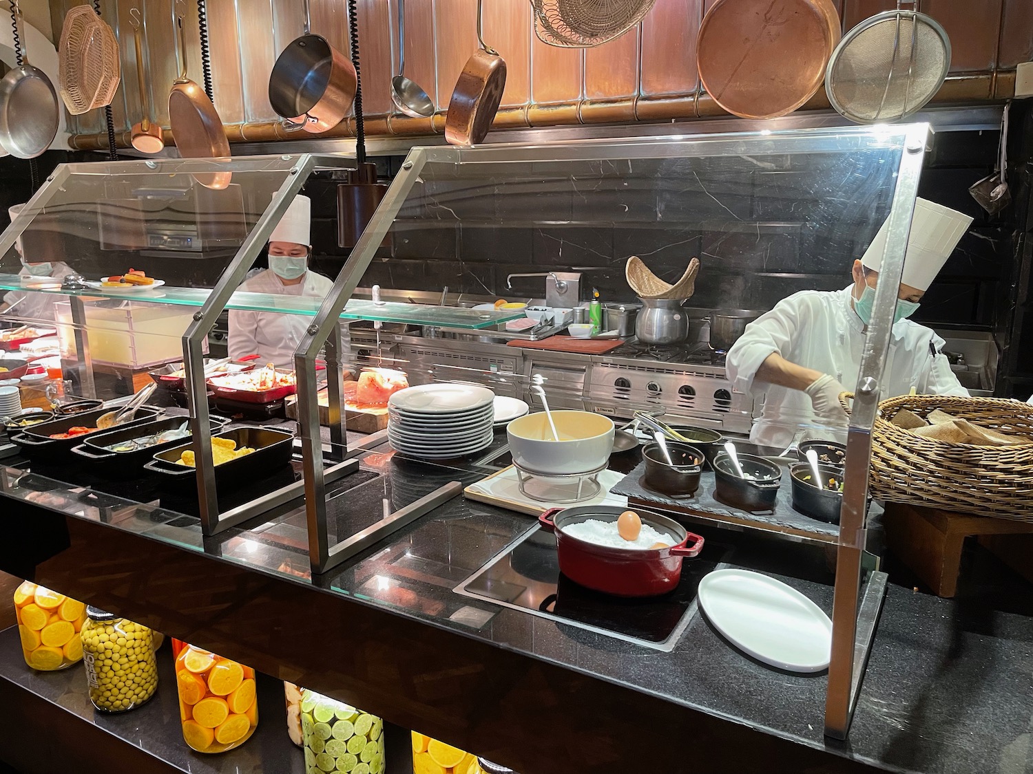 a group of people cooking in a kitchen