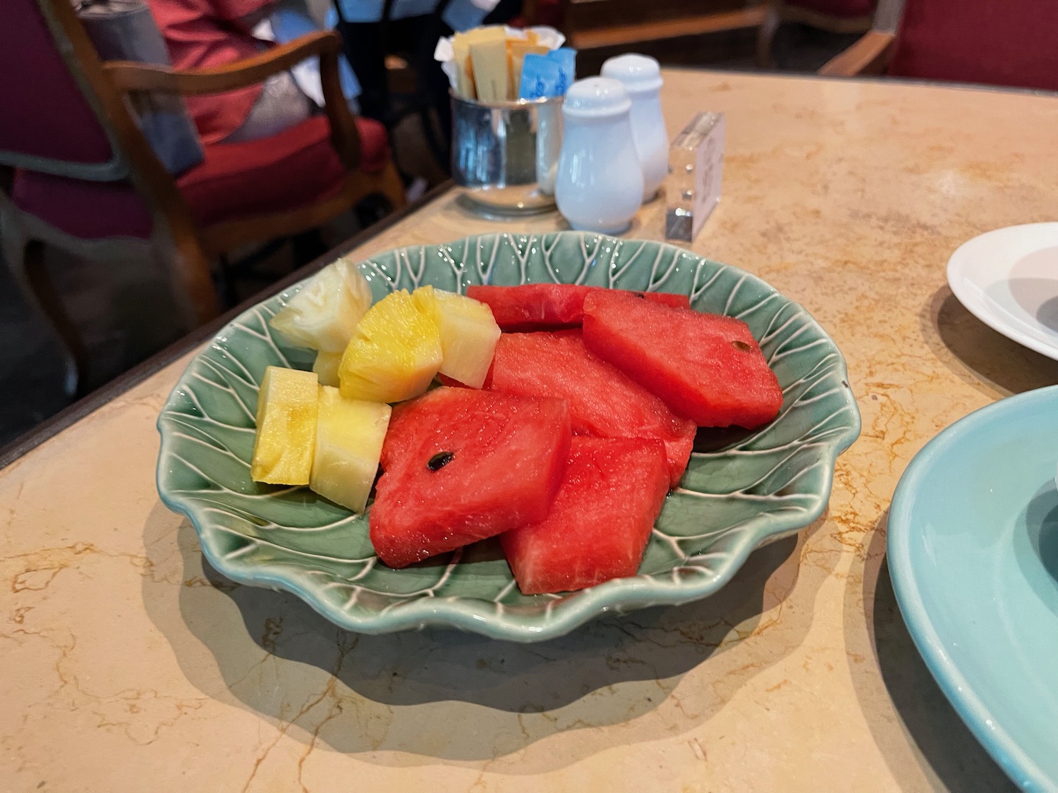 a plate of watermelon and pineapple