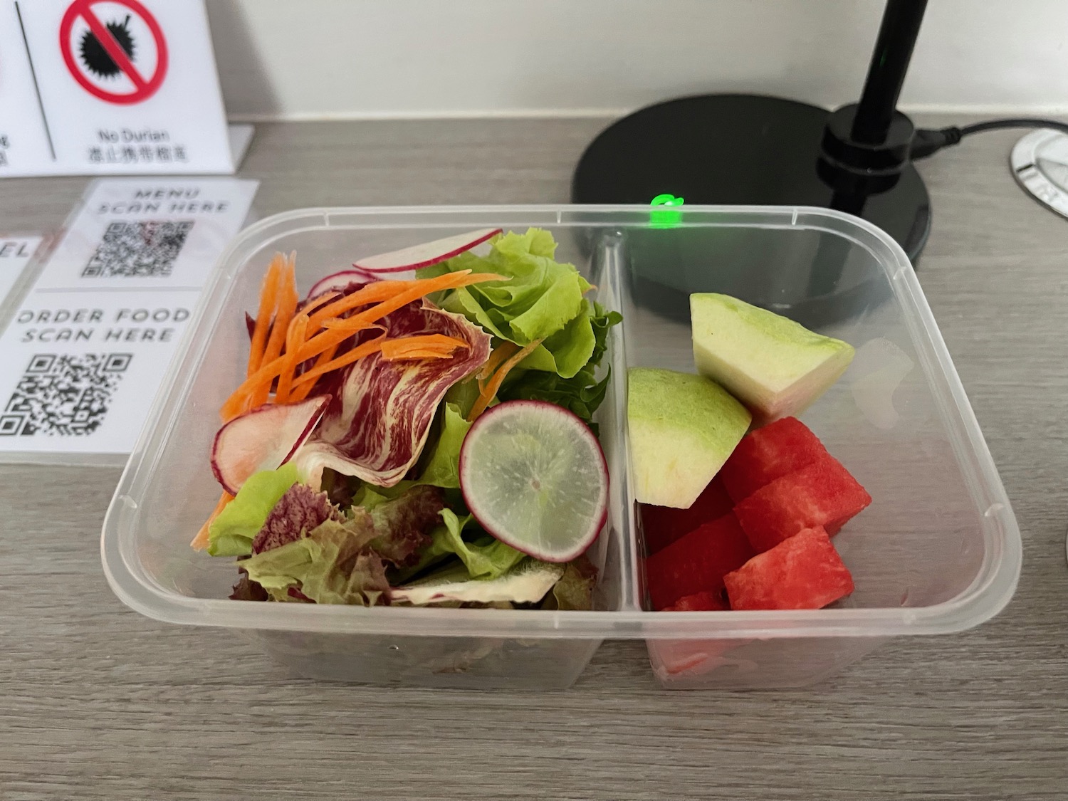 a salad in a plastic container