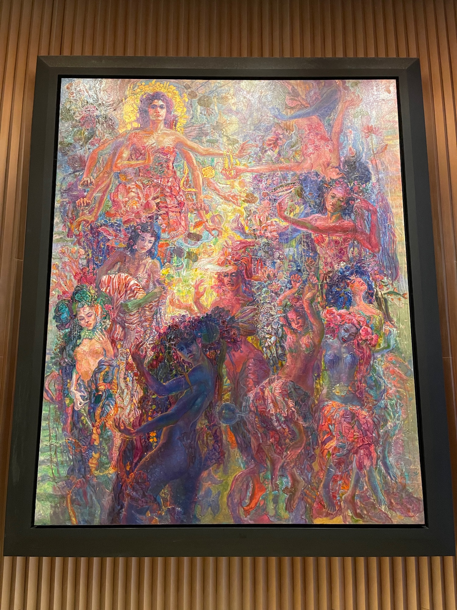 a painting of women in a frame