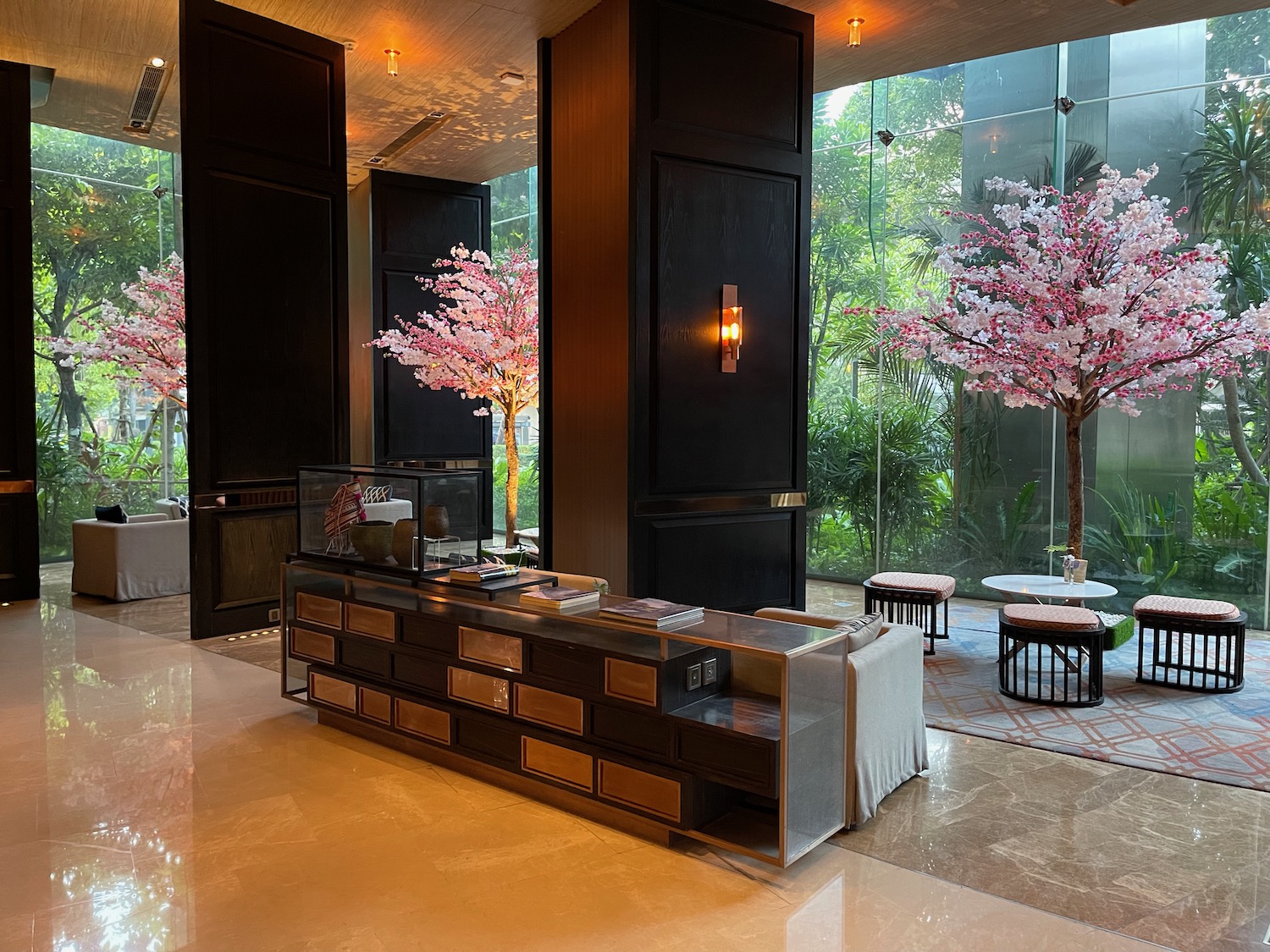 a lobby with a large glass wall and a counter