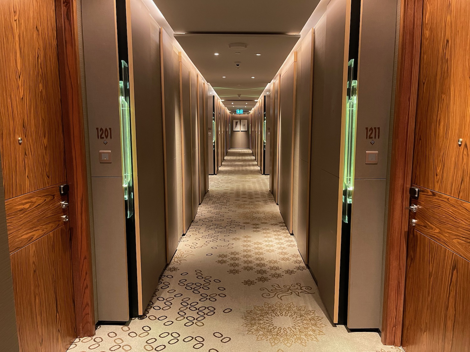 a hallway with doors and lights